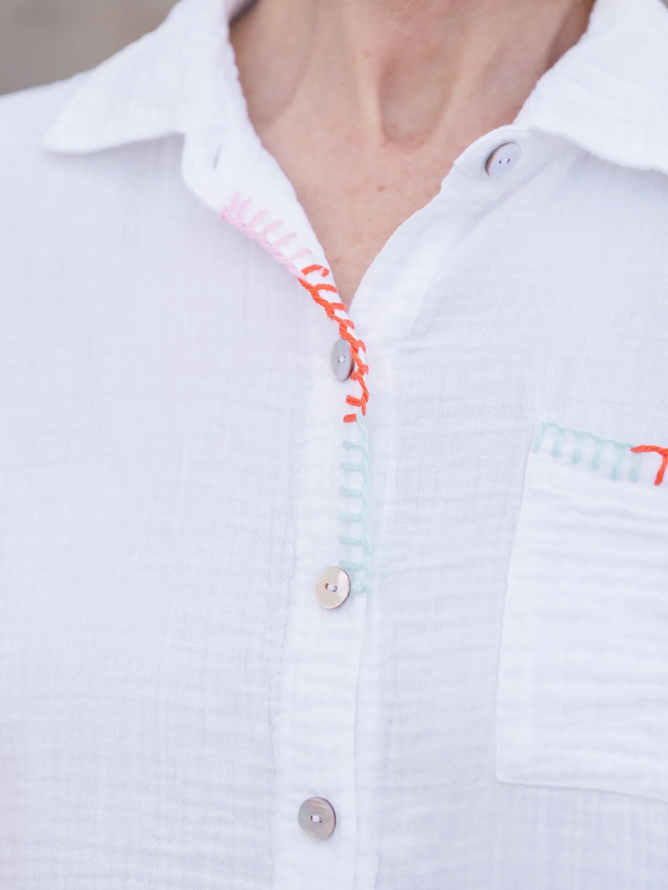 Detail of decorative button hole stitching on Abby Cotton Gauze Button Up Shirt.