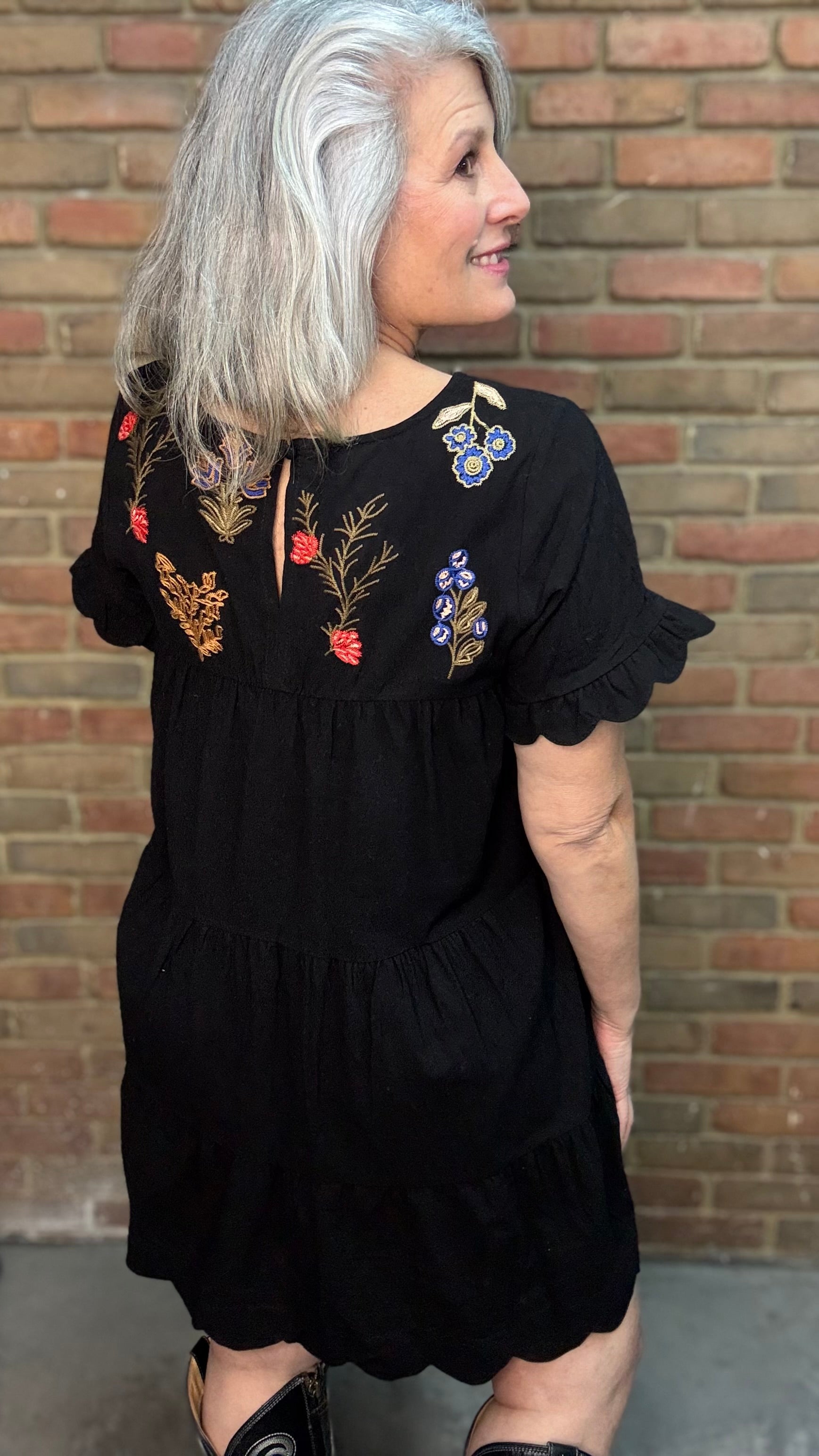 Woman wearing Embroidered Tiered Keyhole Dress paired with Ebony Stitched Western Tall Boots