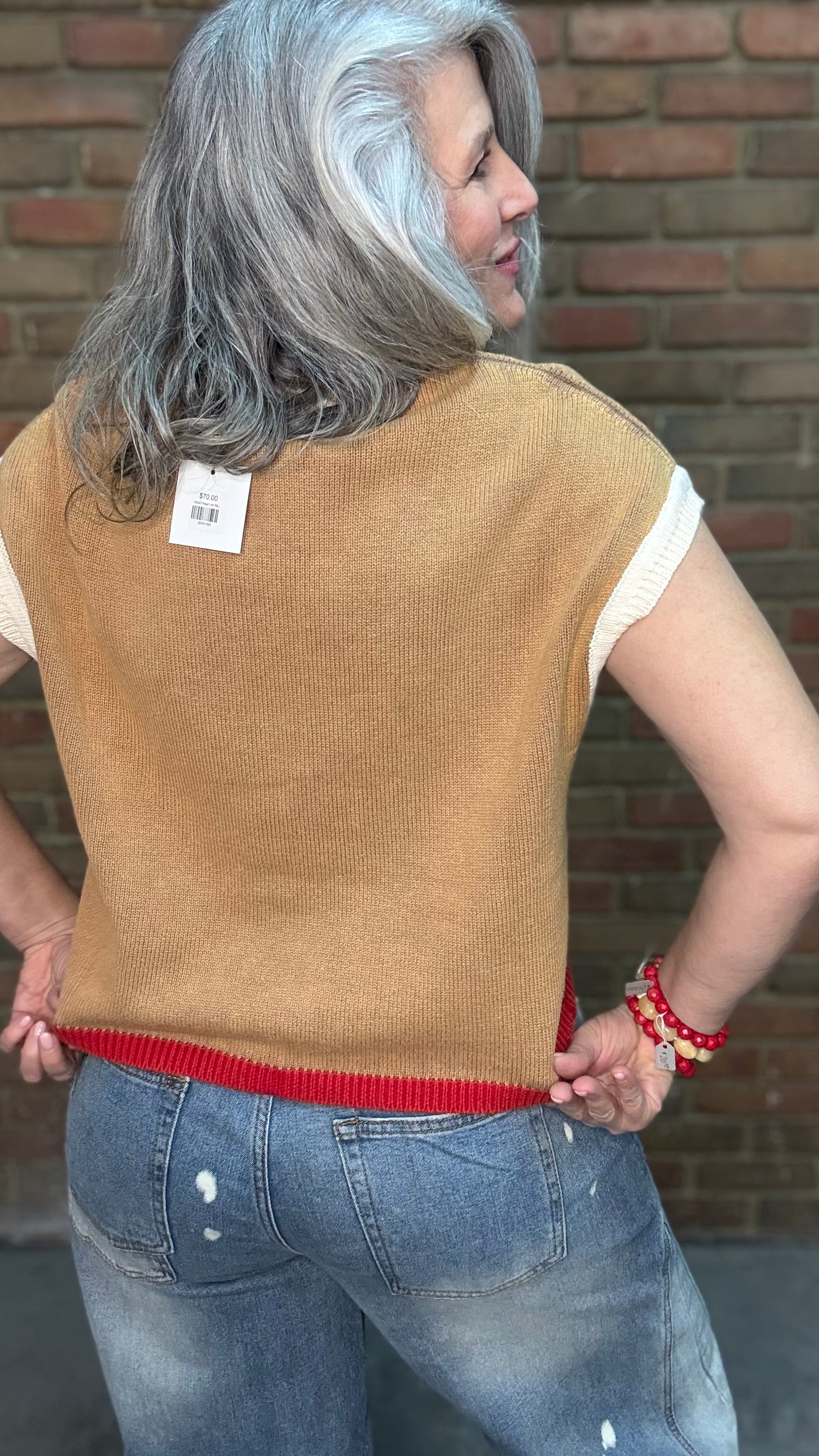 Woman wearing Chestnut Flame Sweater paired with Bleached Wide Leg Jeans and Heads Up - Red Shoes styled with XOXO heart on Red Bead Necklace