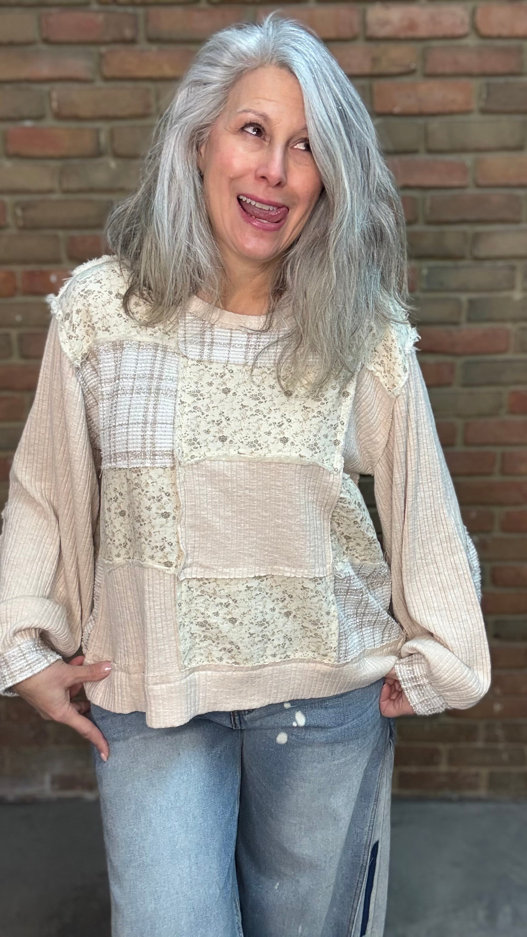 Woman wearing Patchwork Pull-On Top Paired with Bleached Wide Leg Jeans