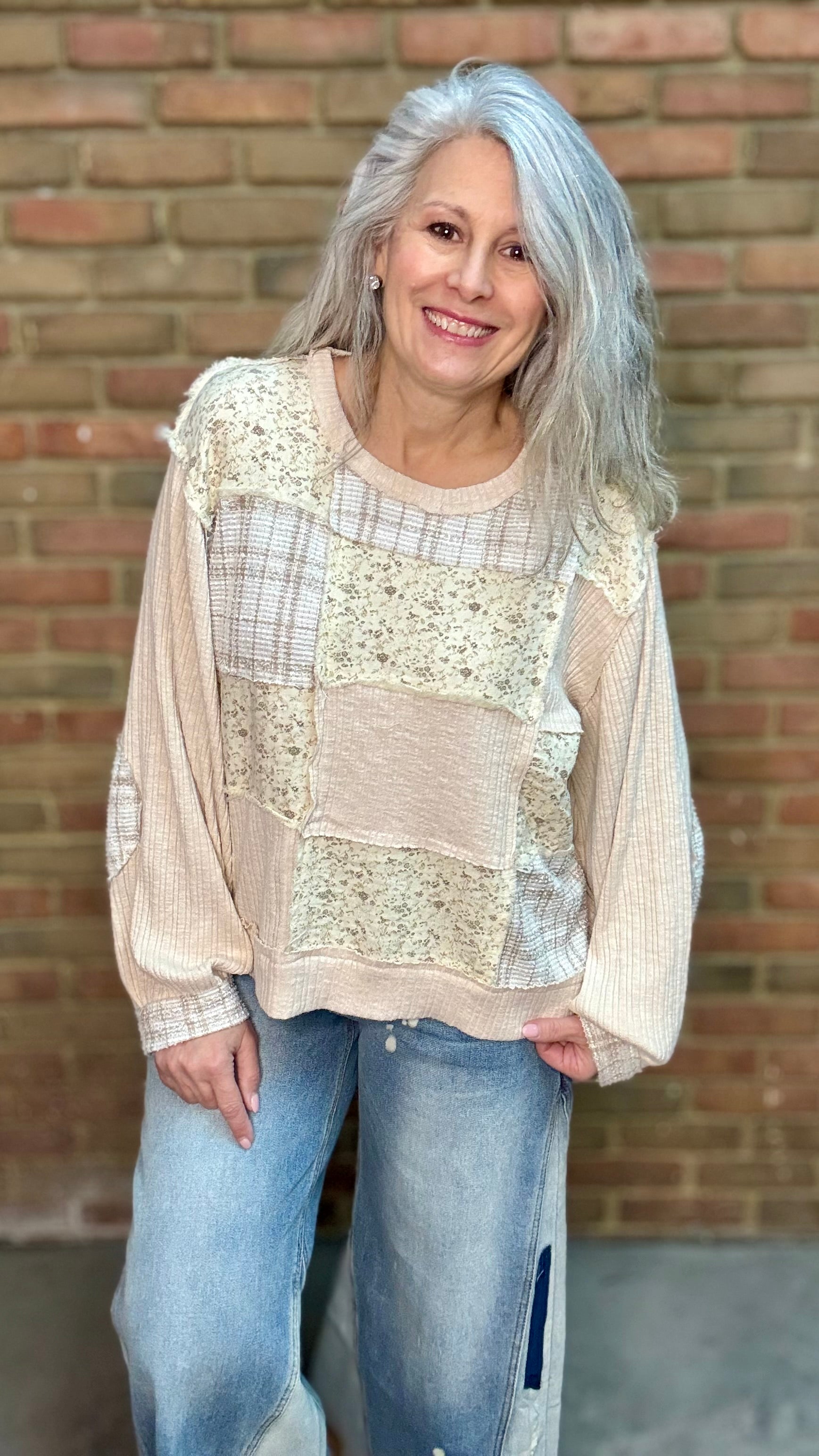 Woman wearing Patchwork Pull-On Top Paired with Bleached Wide Leg Jeans