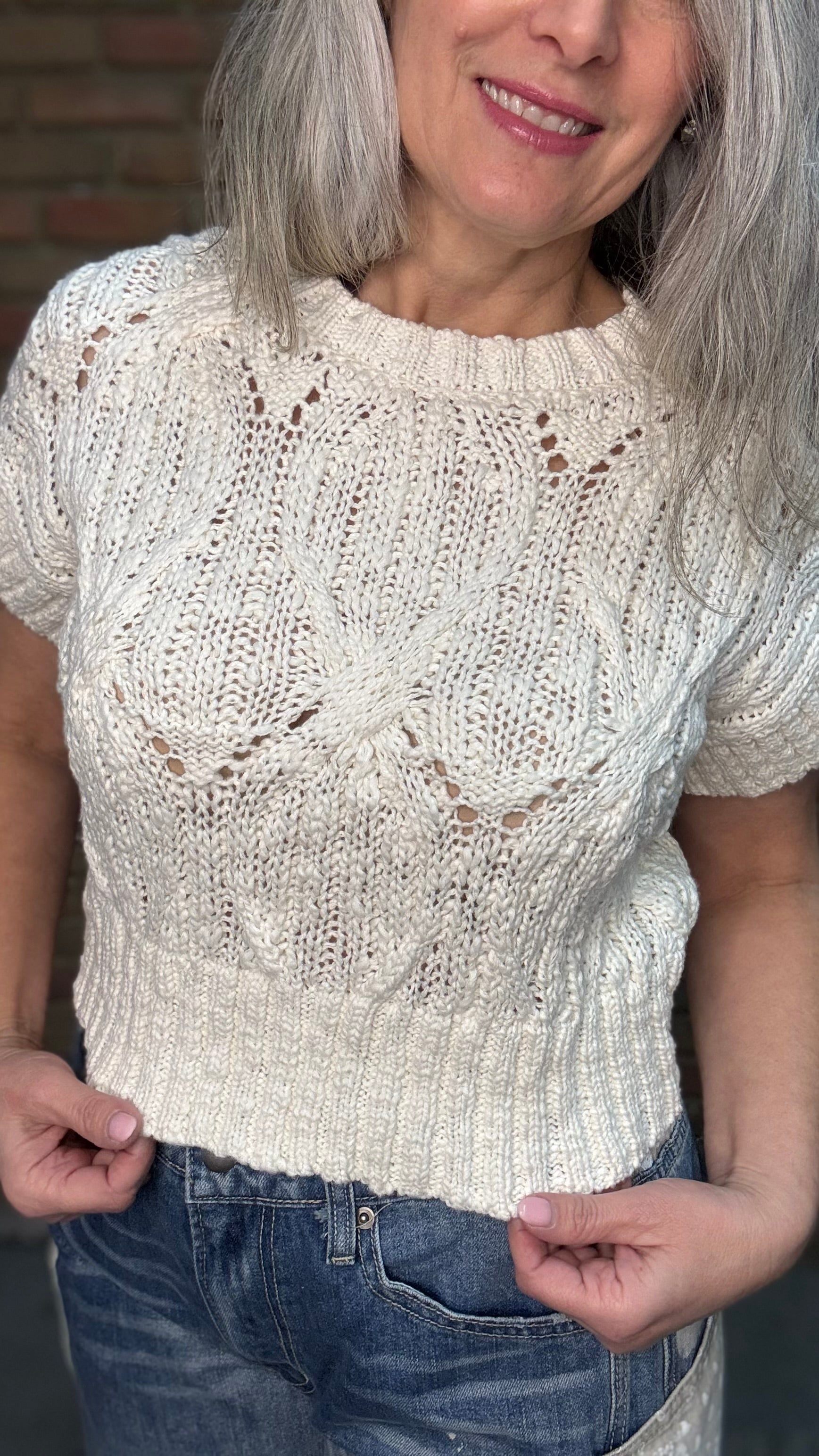 Woman wearing Oatmeal Sweater Top with Big Pocket Denim Pants