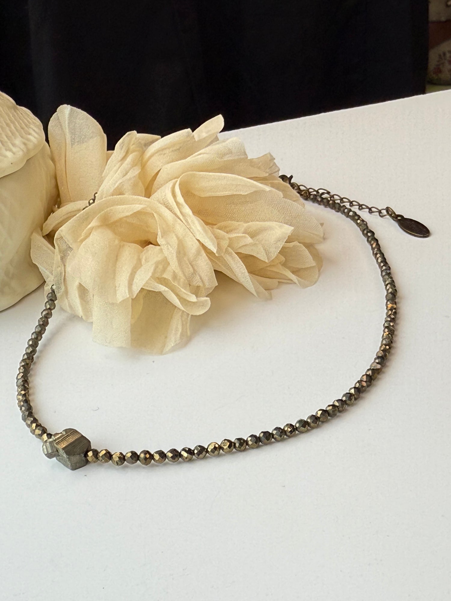 Necklace with a nugget pendant on a white background