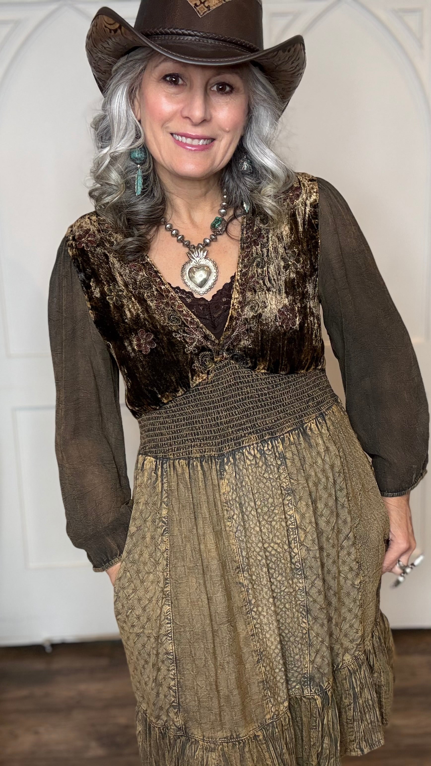 Woman in Amber Smocked Patchwork Babydoll dress and Lane&