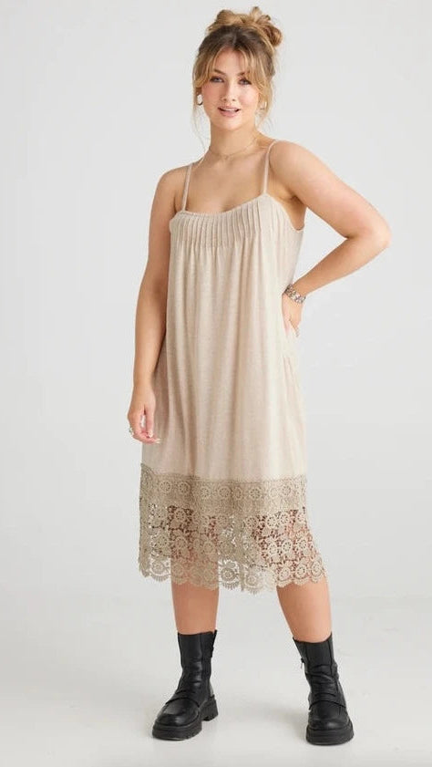 front view of marisol lace edged dress/slip on a model.