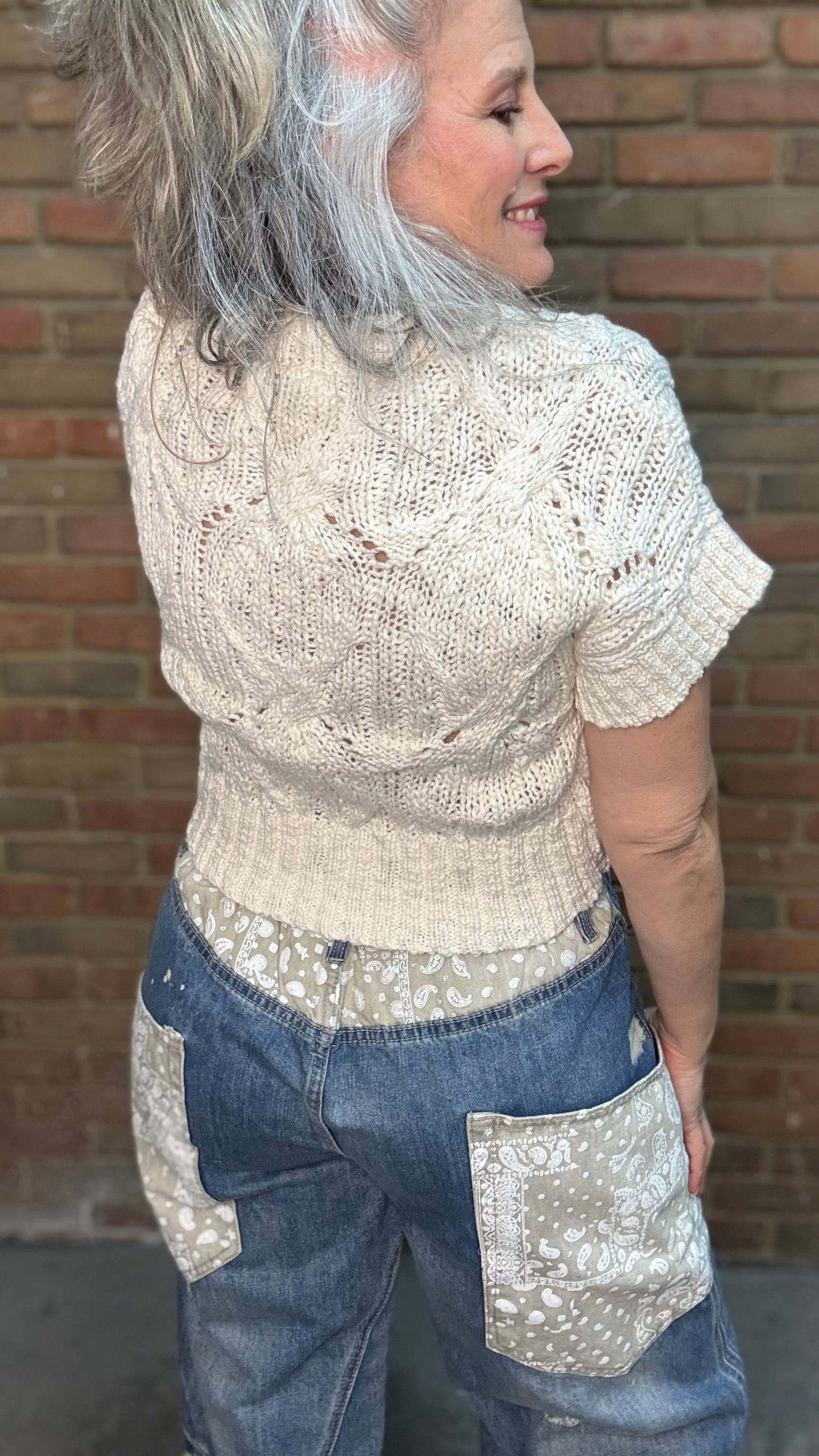 Woman wearing Oatmeal Sweater Top with Big Pocket Denim Pants