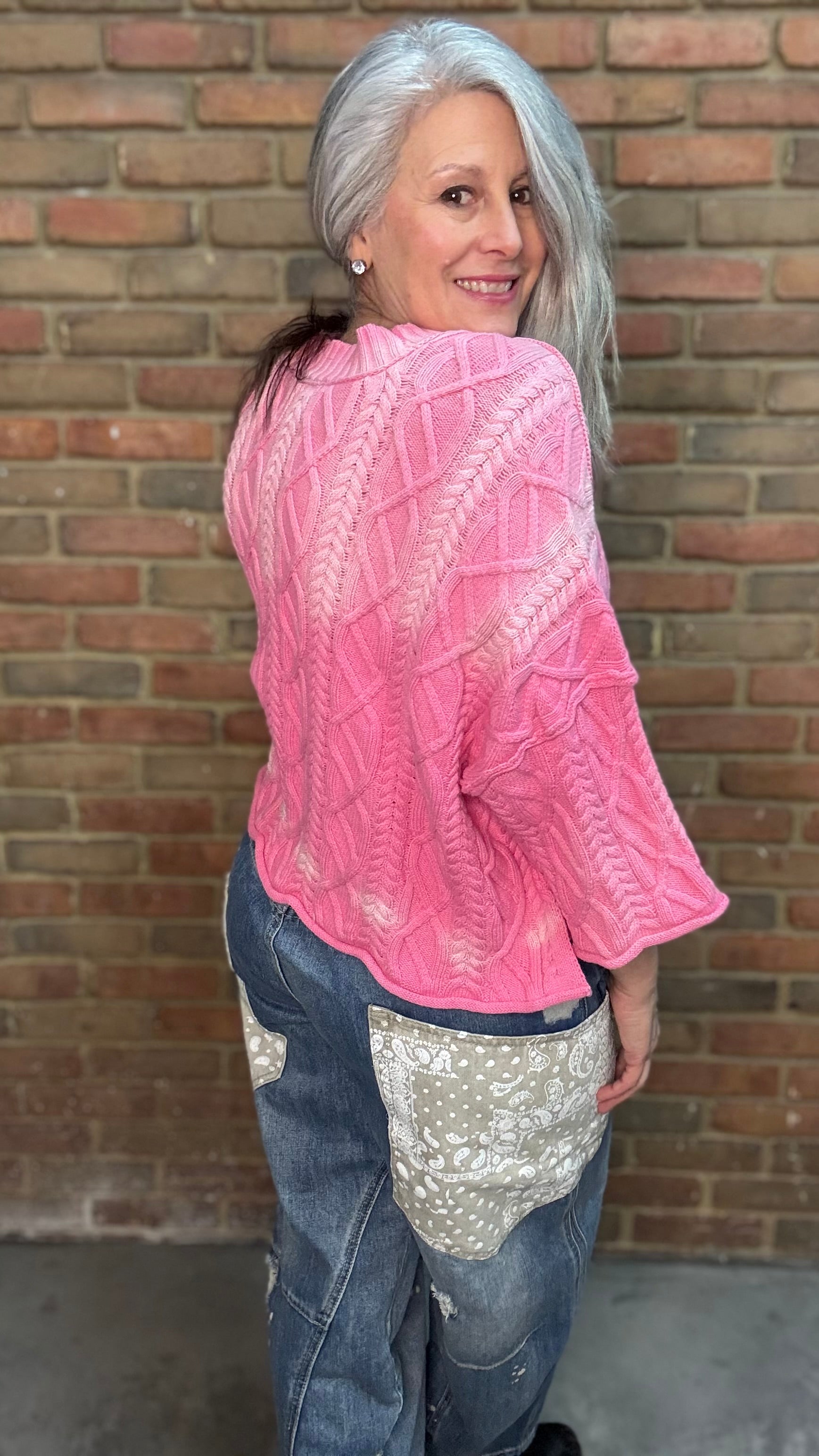 Woman wearing Dusty Pink Ombre Sweater paired with Big Pocket Denim Pants
