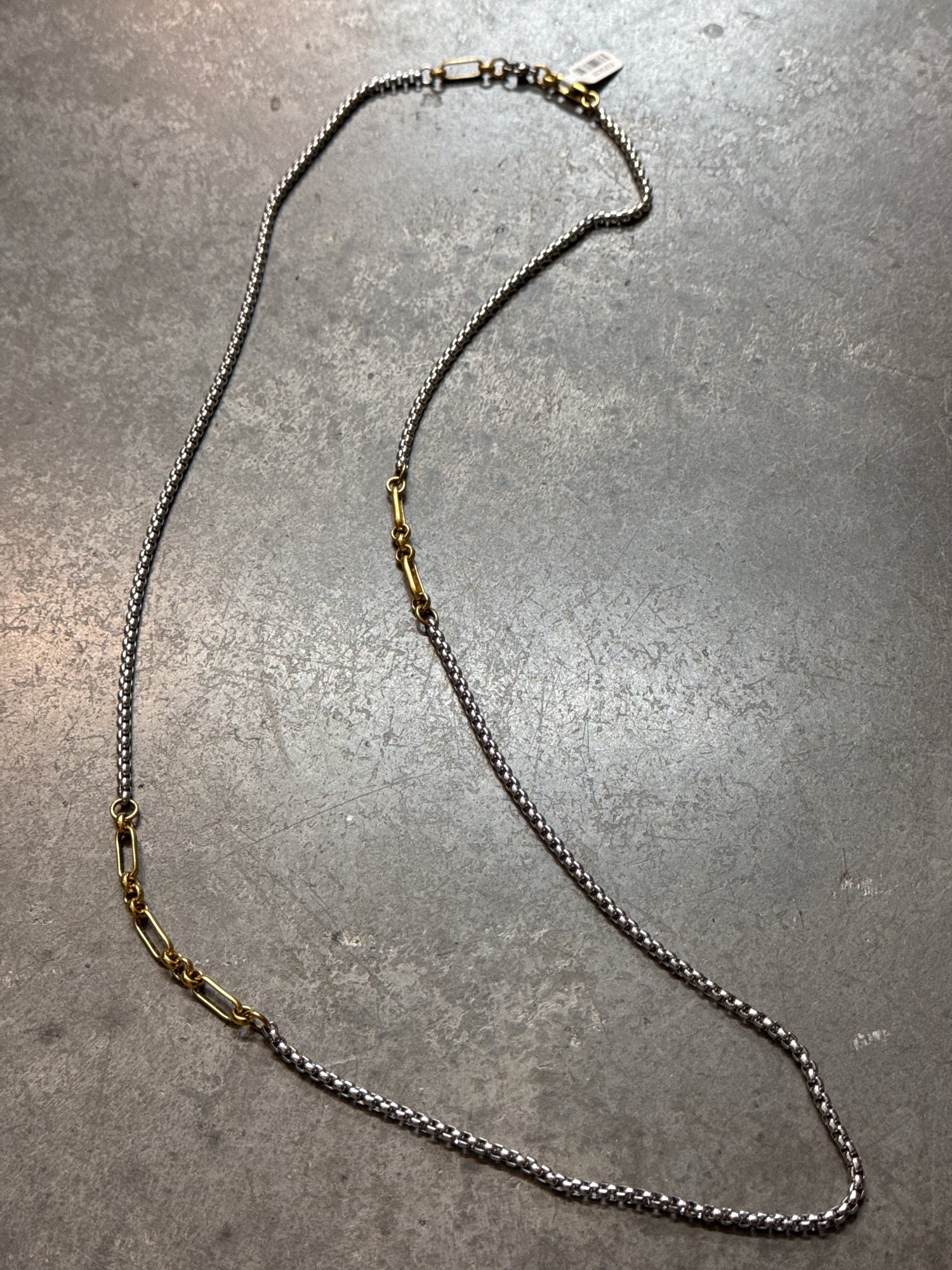 Necklace on a gray surface