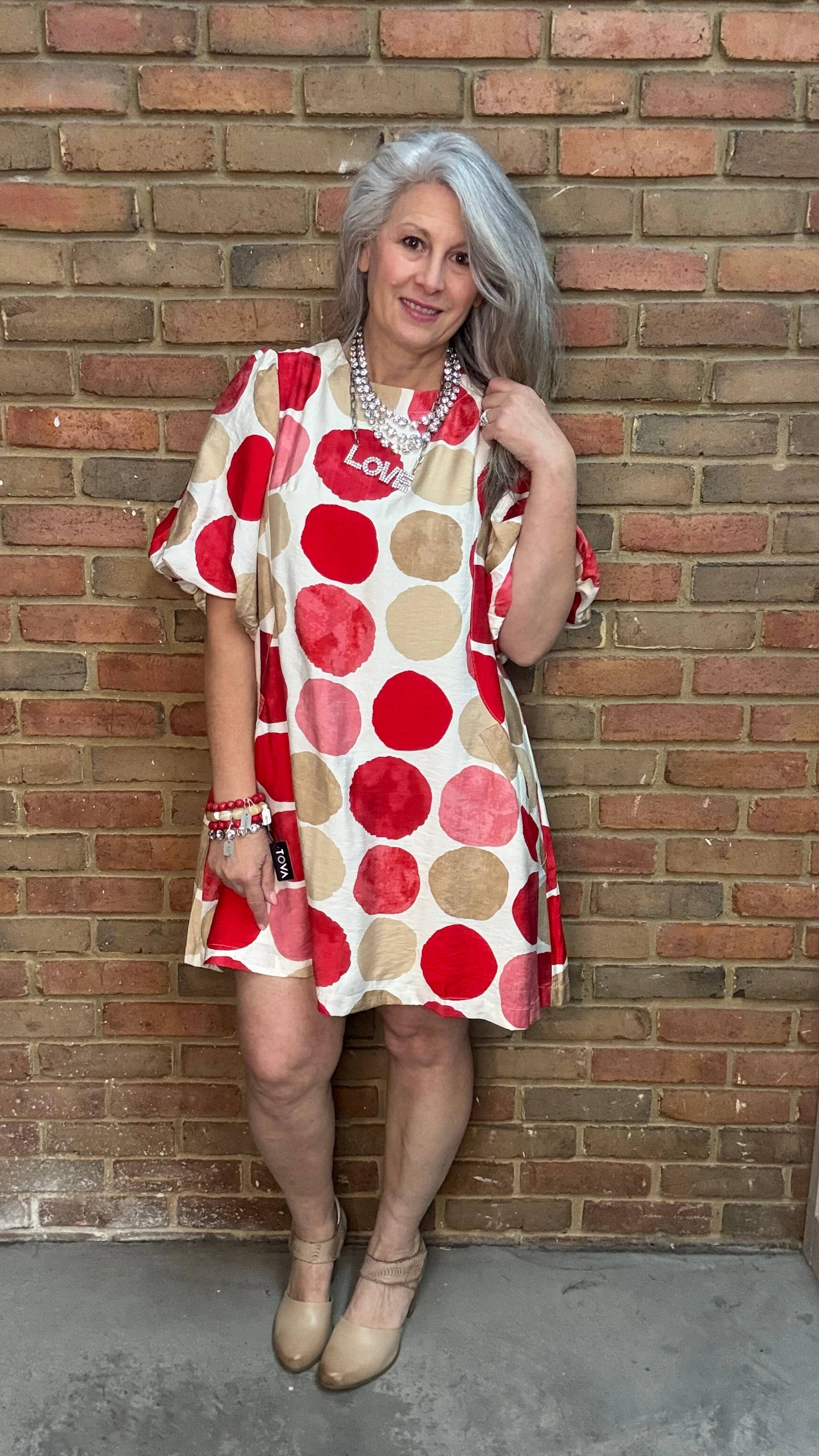 Woman wearing Red Mix Bubble Sleeve Mini Dress with Toolie Shoe Beige