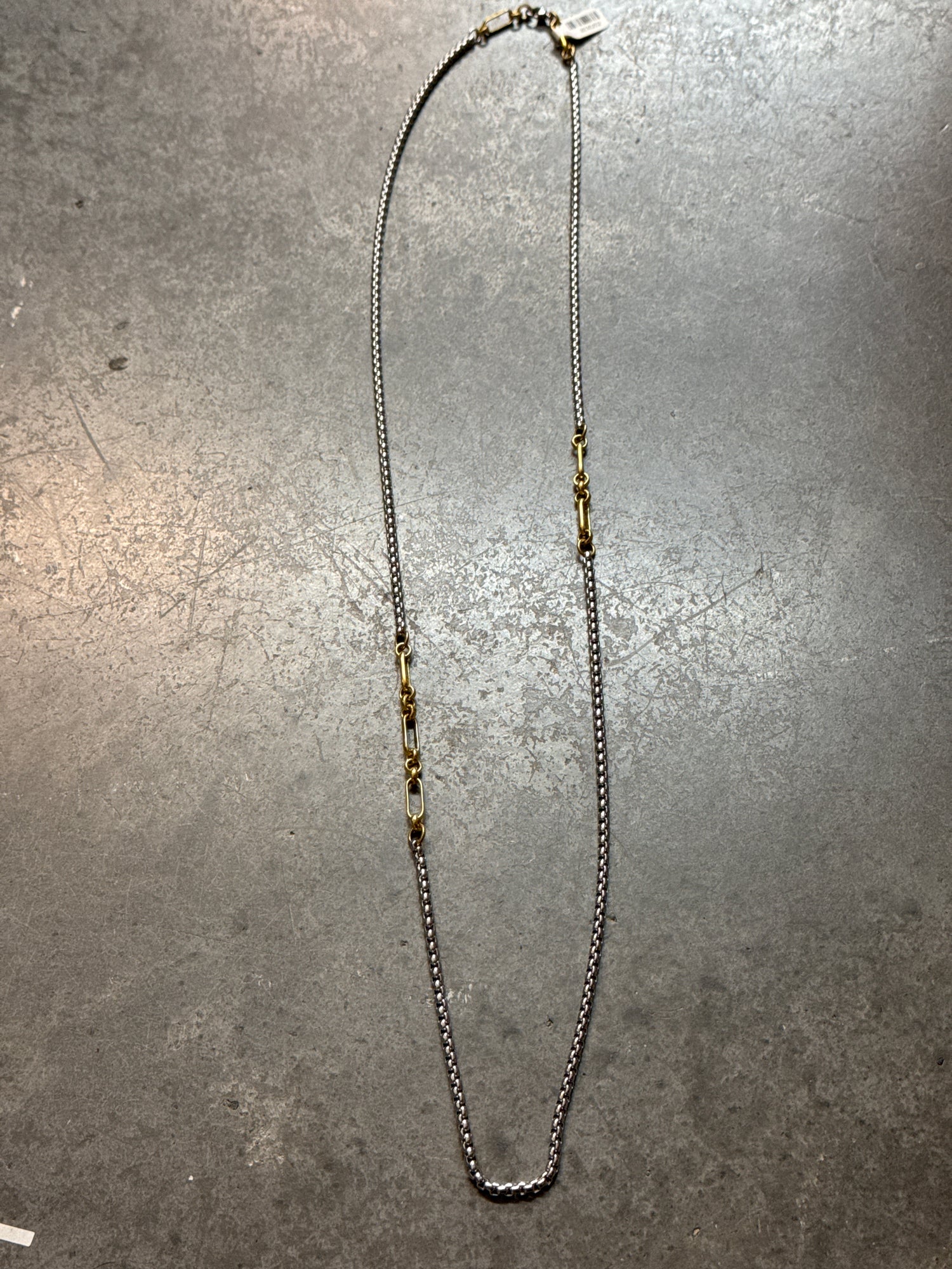 Necklace on a gray surface