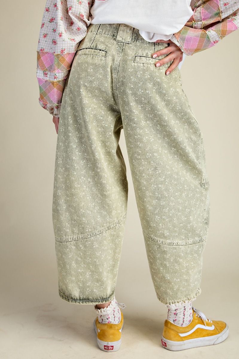 Person wearing the Floral Printed Barrel Pants standing against a white wall.