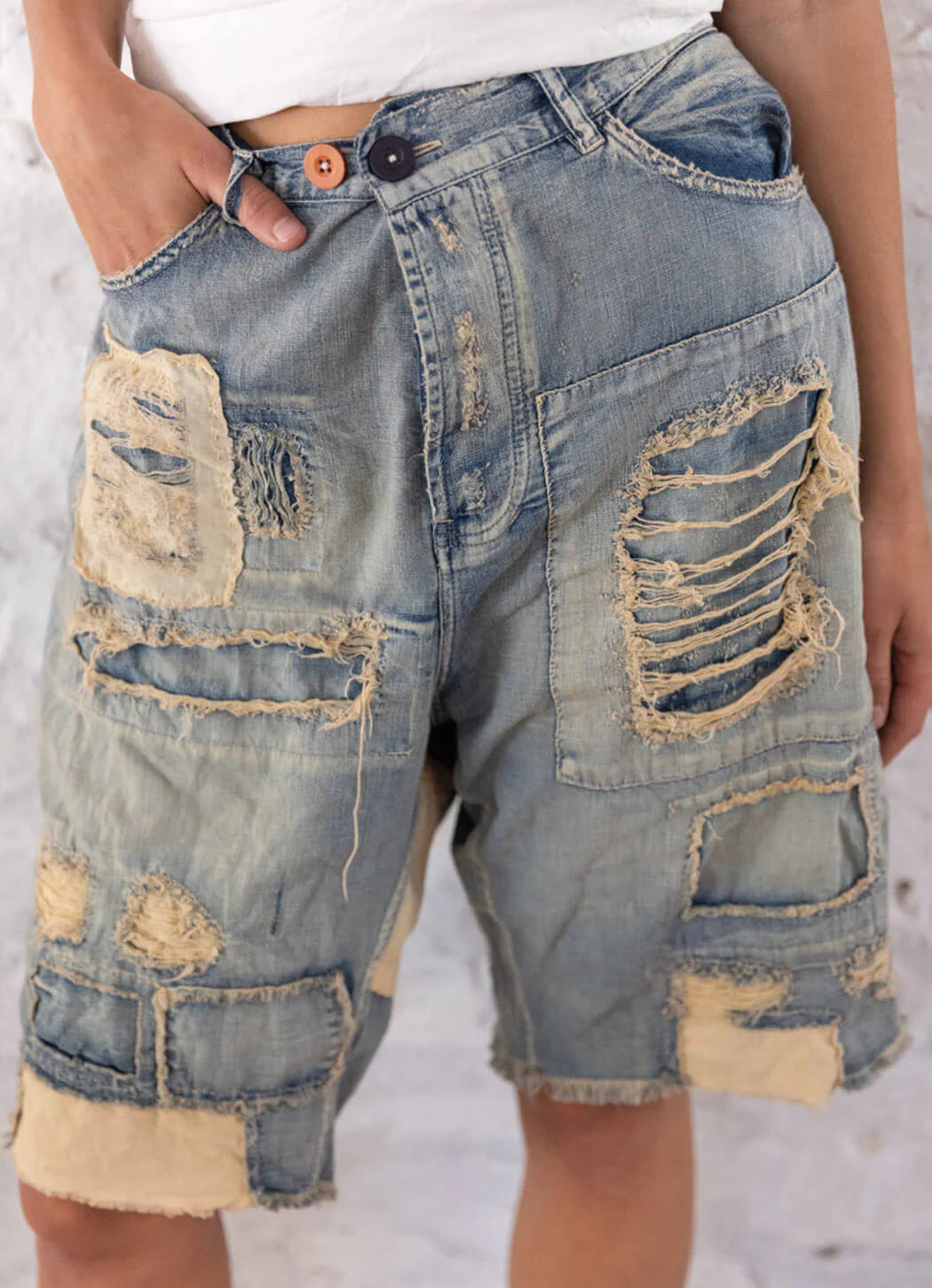 close up front view of Miner Denim Shorts on a model.