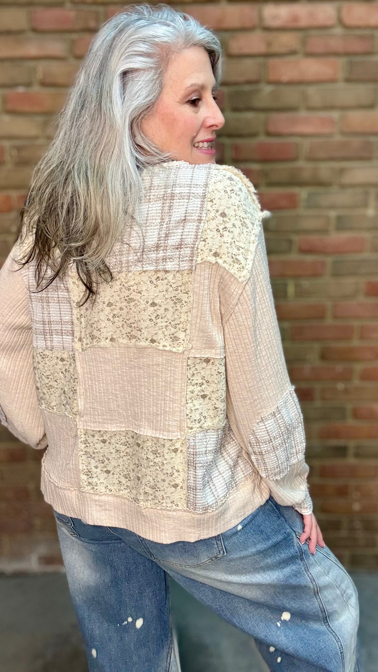 Woman wearing Patchwork Pull-On Top Paired with Bleached Wide Leg Jeans