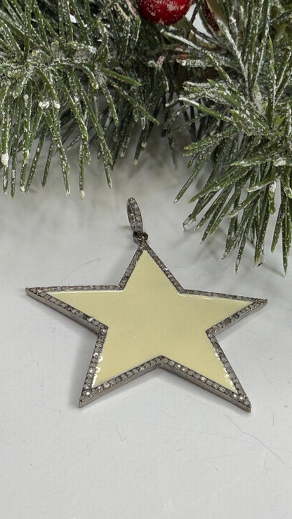 Star-shaped Christmas ornament on a snowy branch