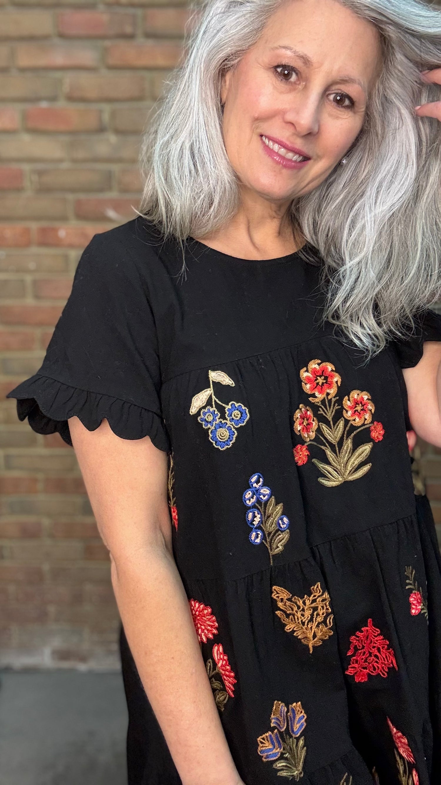 Woman wearing Embroidered Tiered Keyhole Dress paired with Ebony Stitched Western Tall Boots