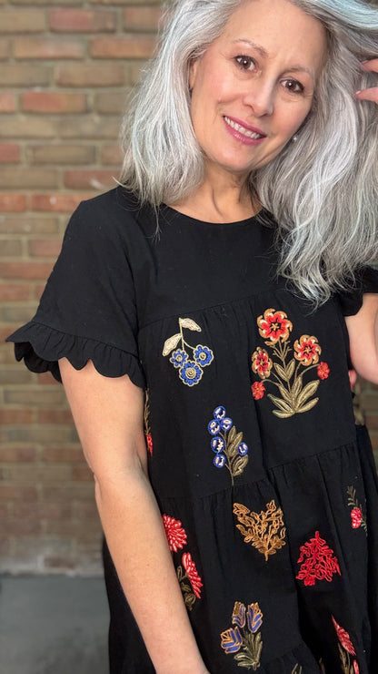 Woman wearing Embroidered Tiered Keyhole Dress paired with Ebony Stitched Western Tall Boots