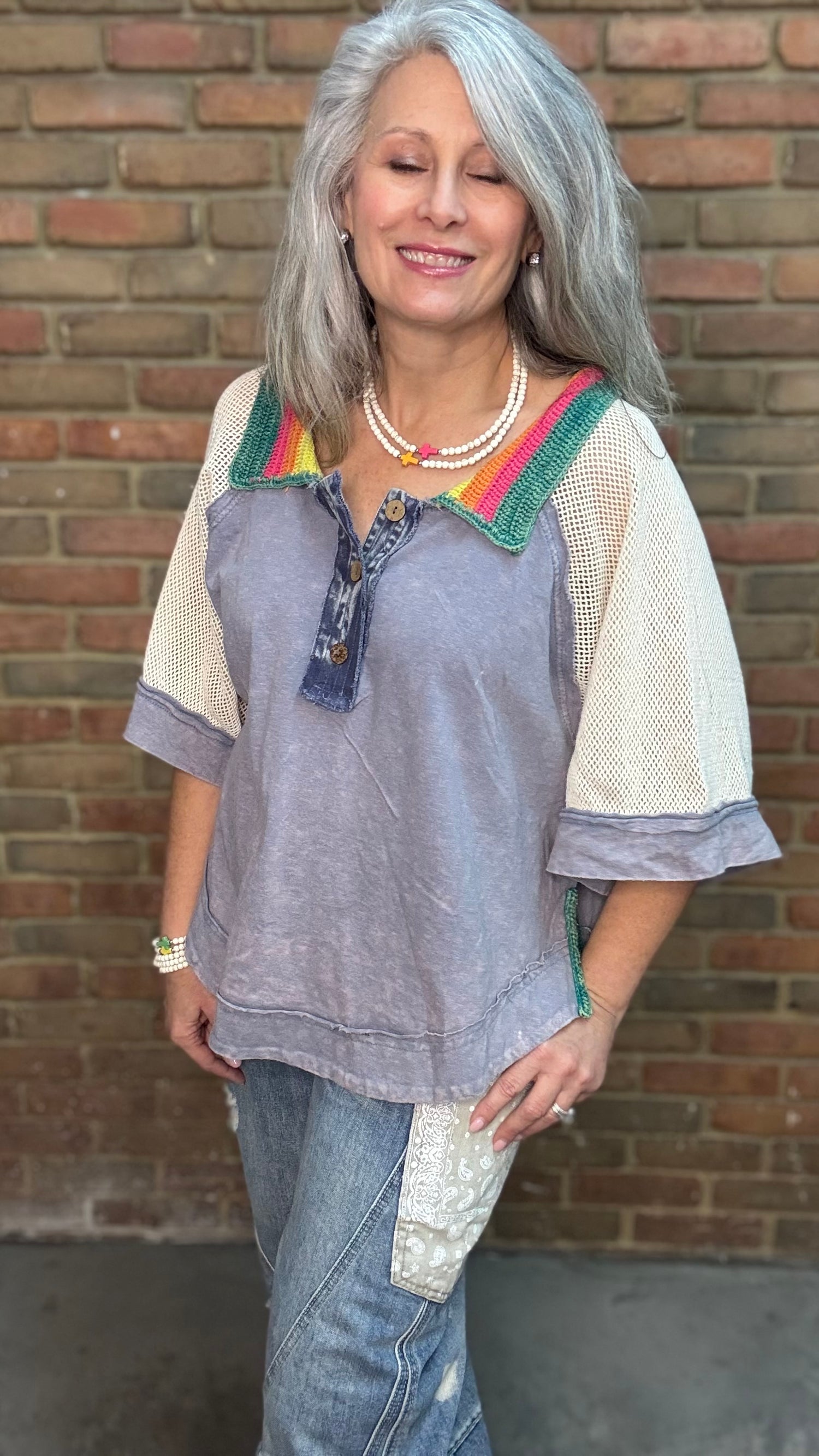 Woman wearing Rainbow Collar Henley Top paired with Big Pocket Denim Pants and the Brittney Necklace and Brittney 5 Piece Bracelet Set