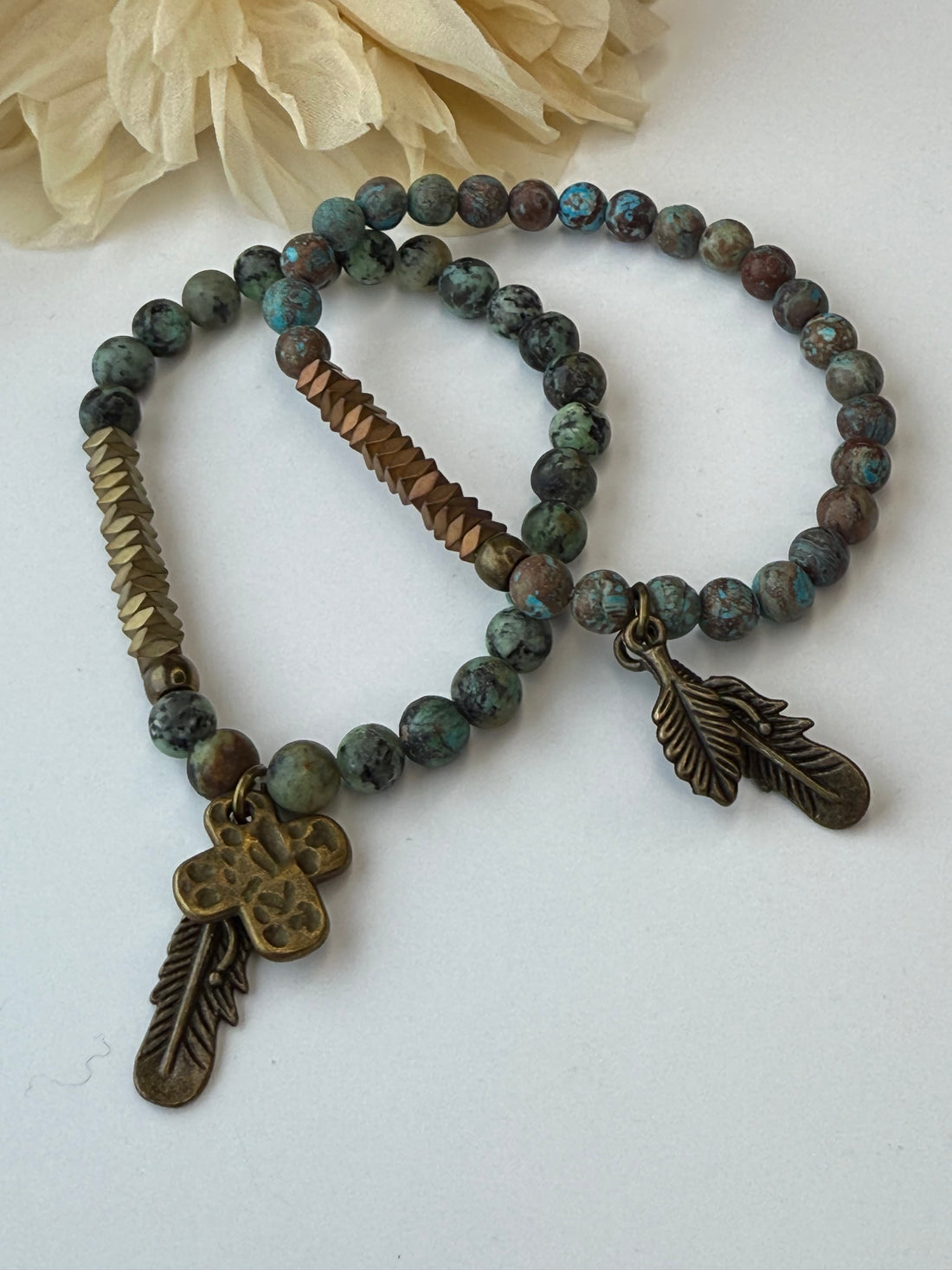Bracelets with beads and decorative elements on a white background