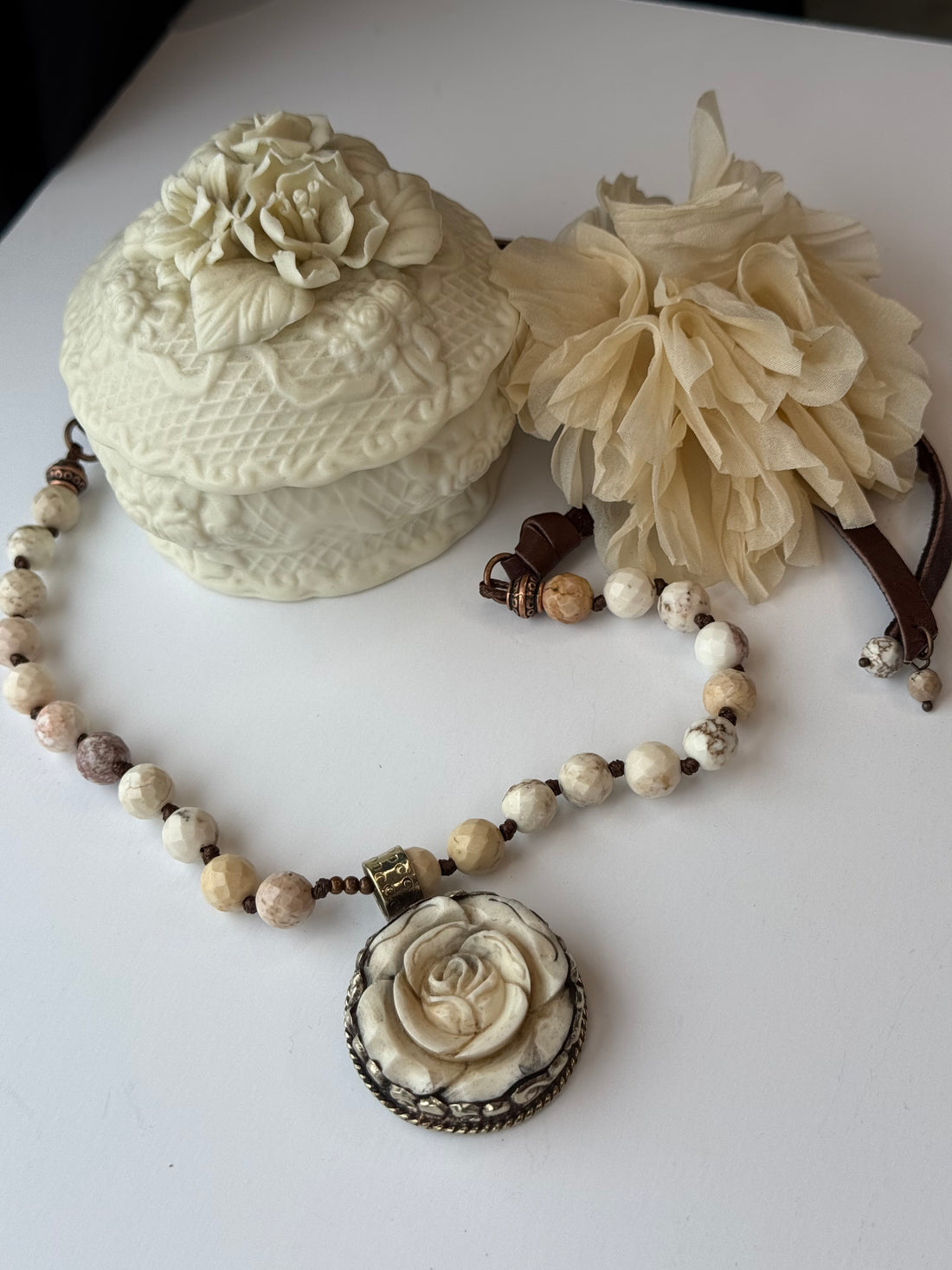 Necklace with floral elements on a white surface