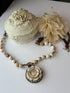 Necklace with floral elements on a white surface
