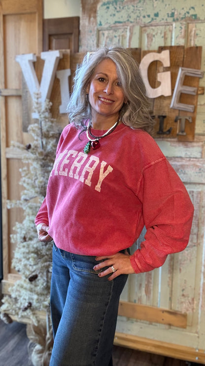 Woman wearing a red sweatshirt with &