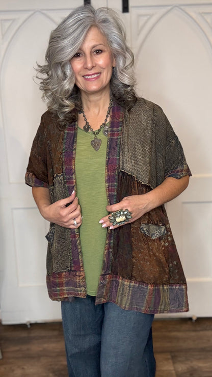 Woman wearing Boho Kimono Shrug Cardigan over a Moon Dance V-Neck in Olive and Judy Blue Palazzo Patch Pocket jeans in front of a white door.