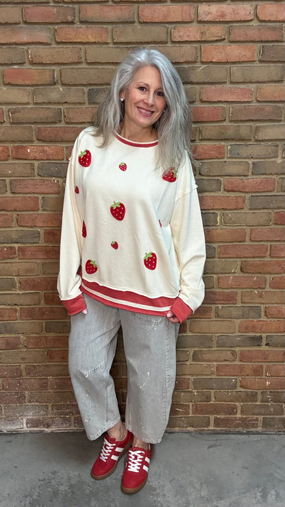 Woman wearing Strawberry Sweatshirt with Oyster Grey Big Pocket Jeans and Heads Up - Red Shoes