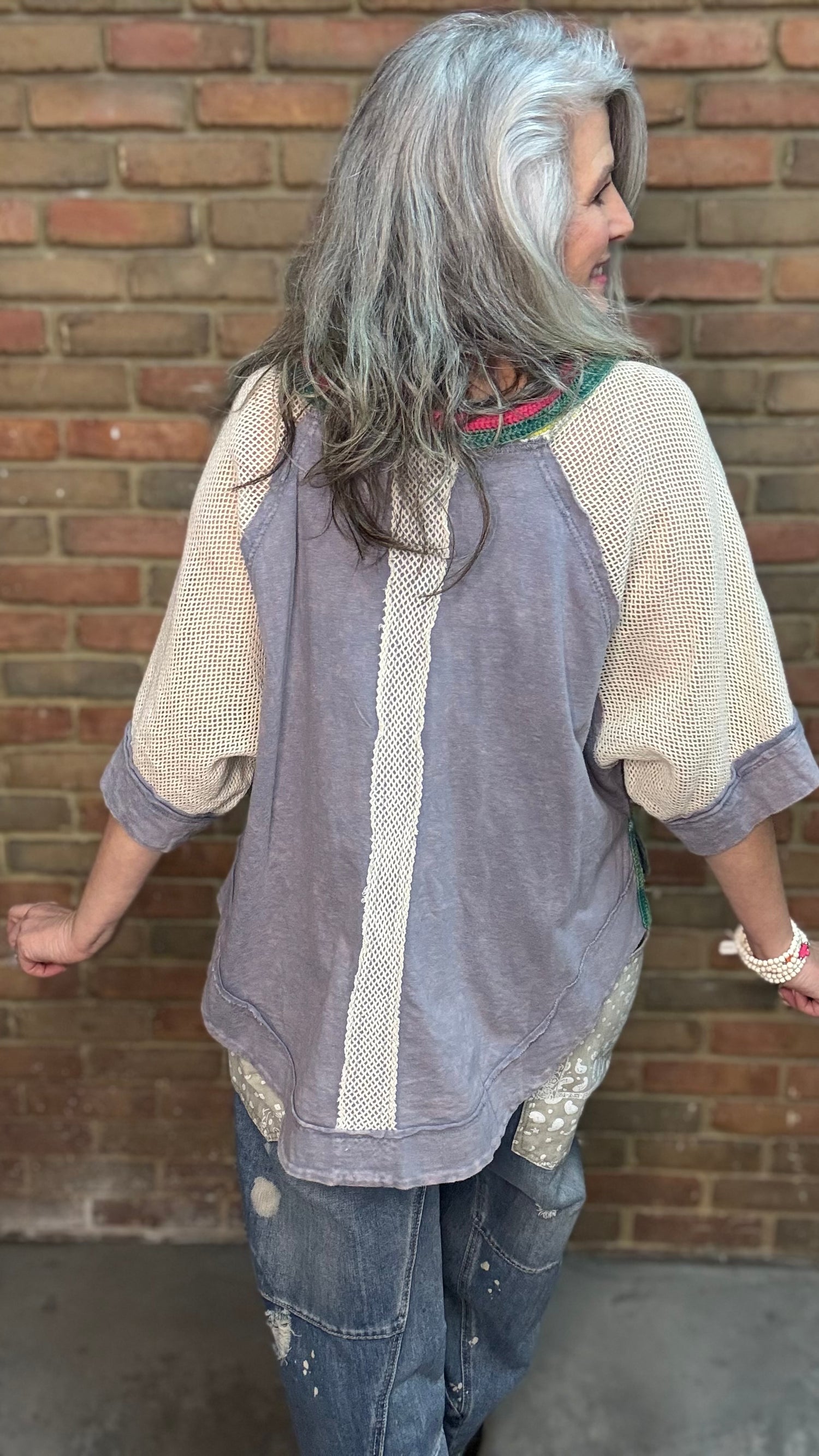 Woman wearing Rainbow Collar Henley Top paired with Big Pocket Denim Pants and the Brittney Necklace and Brittney 5 Piece Bracelet Set