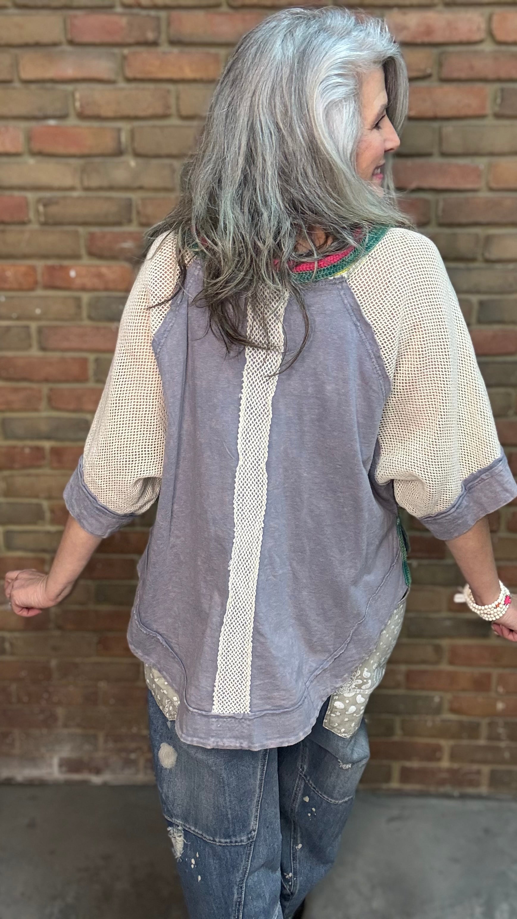 Woman wearing Rainbow Collar Henley Top paired with Big Pocket Denim Pants and the Brittney Necklace and Brittney 5 Piece Bracelet Set