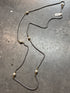 Necklace with pearls on a gray surface