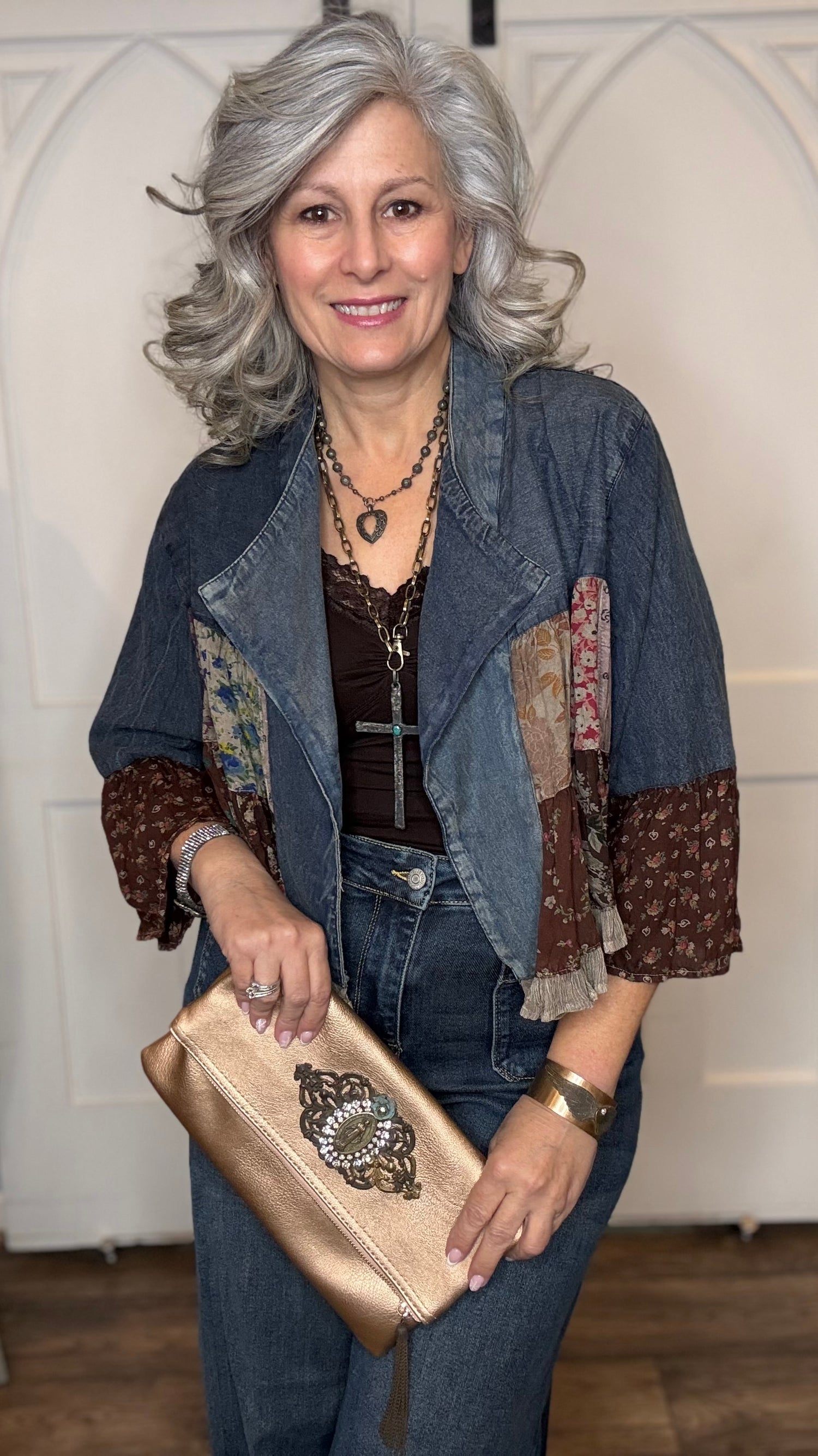 Woman wearing the Vintage Lapel Crop Jacket with Judy Blue Palazzo Patch Pocket Jeans, holding Peach Leather Embellished Clutch.