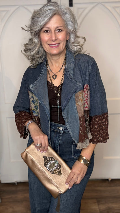 Woman wearing the Vintage Lapel Crop Jacket with Judy Blue Palazzo Patch Pocket Jeans, holding Peach Leather Embellished Clutch.