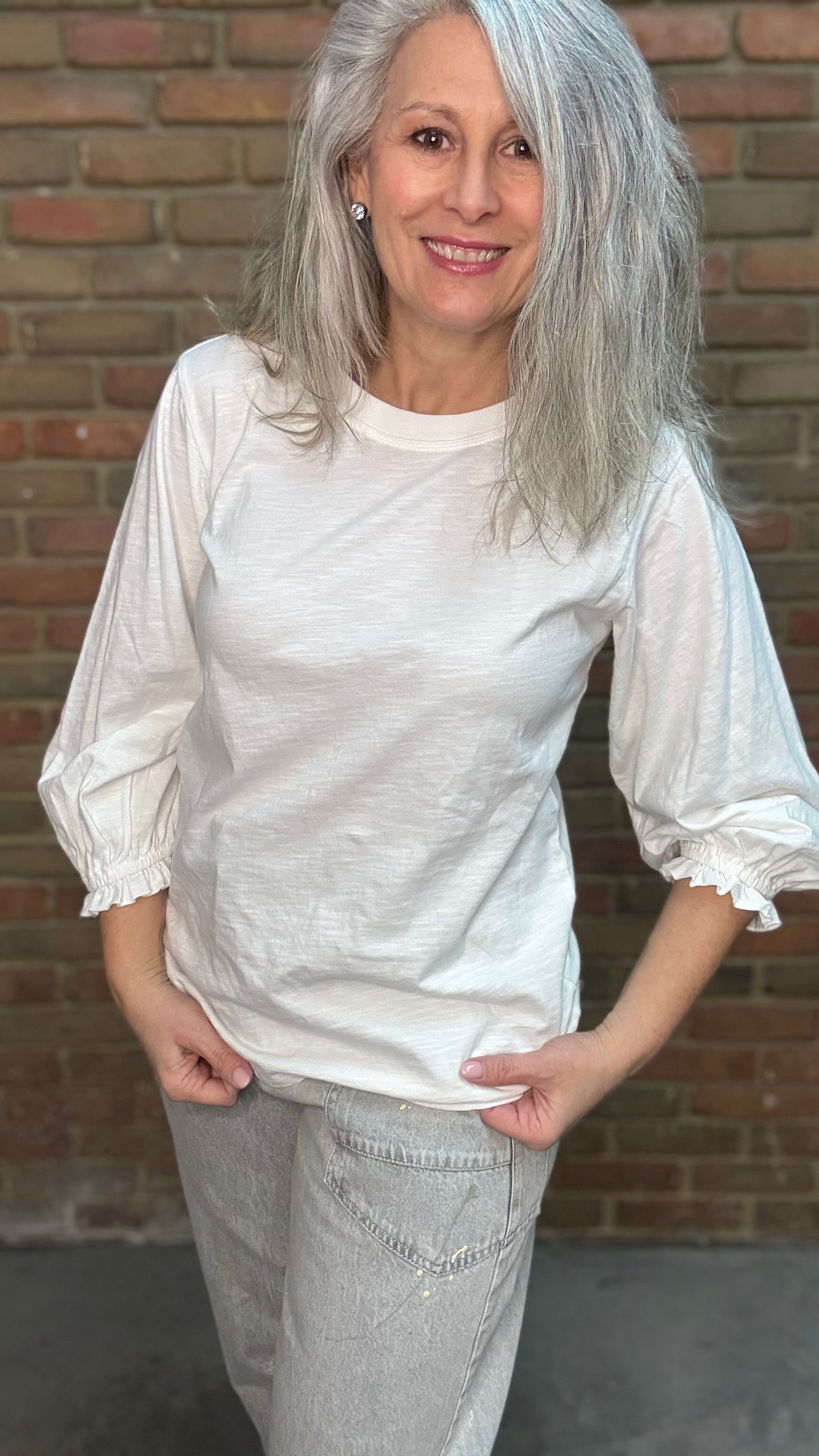 Woman wearing the Basic Long Sleeve Crew Neck Top in White paired with Oyster Grey Big Pocket Jeans