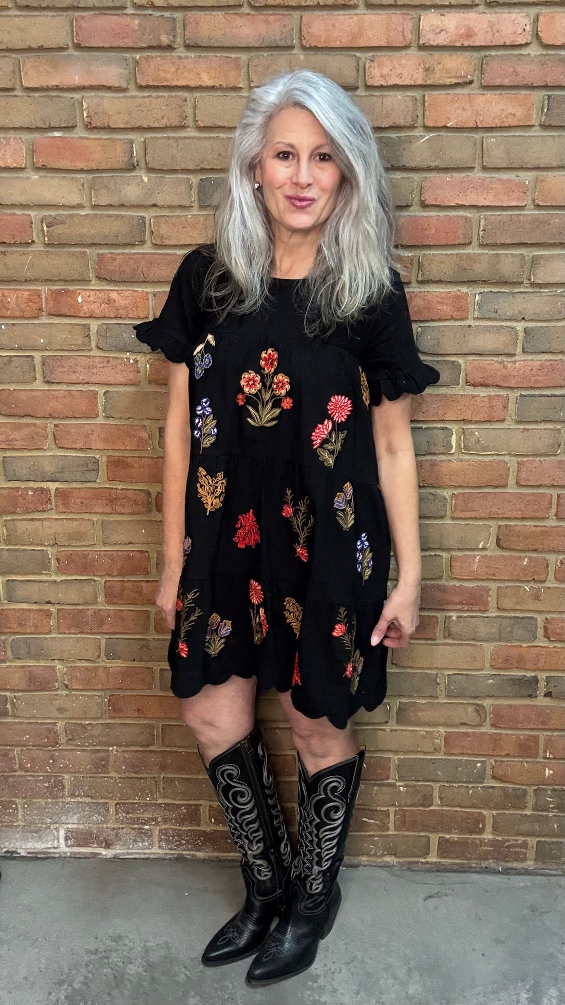 Woman wearing Embroidered Tiered Keyhole Dress paired with Ebony Stitched Western Tall Boots