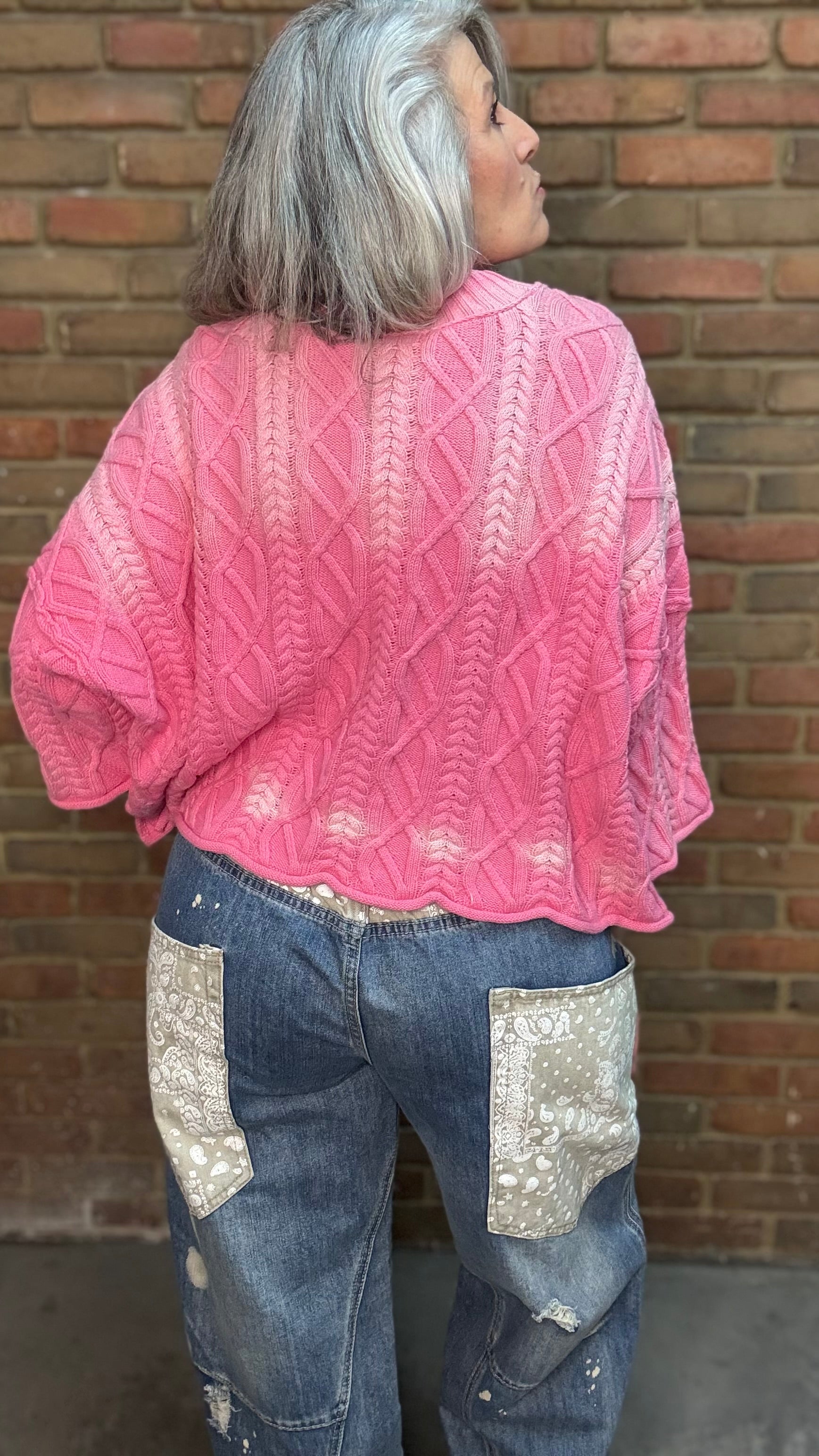 Woman wearing Dusty Pink Ombre Sweater paired with Big Pocket Denim Pants