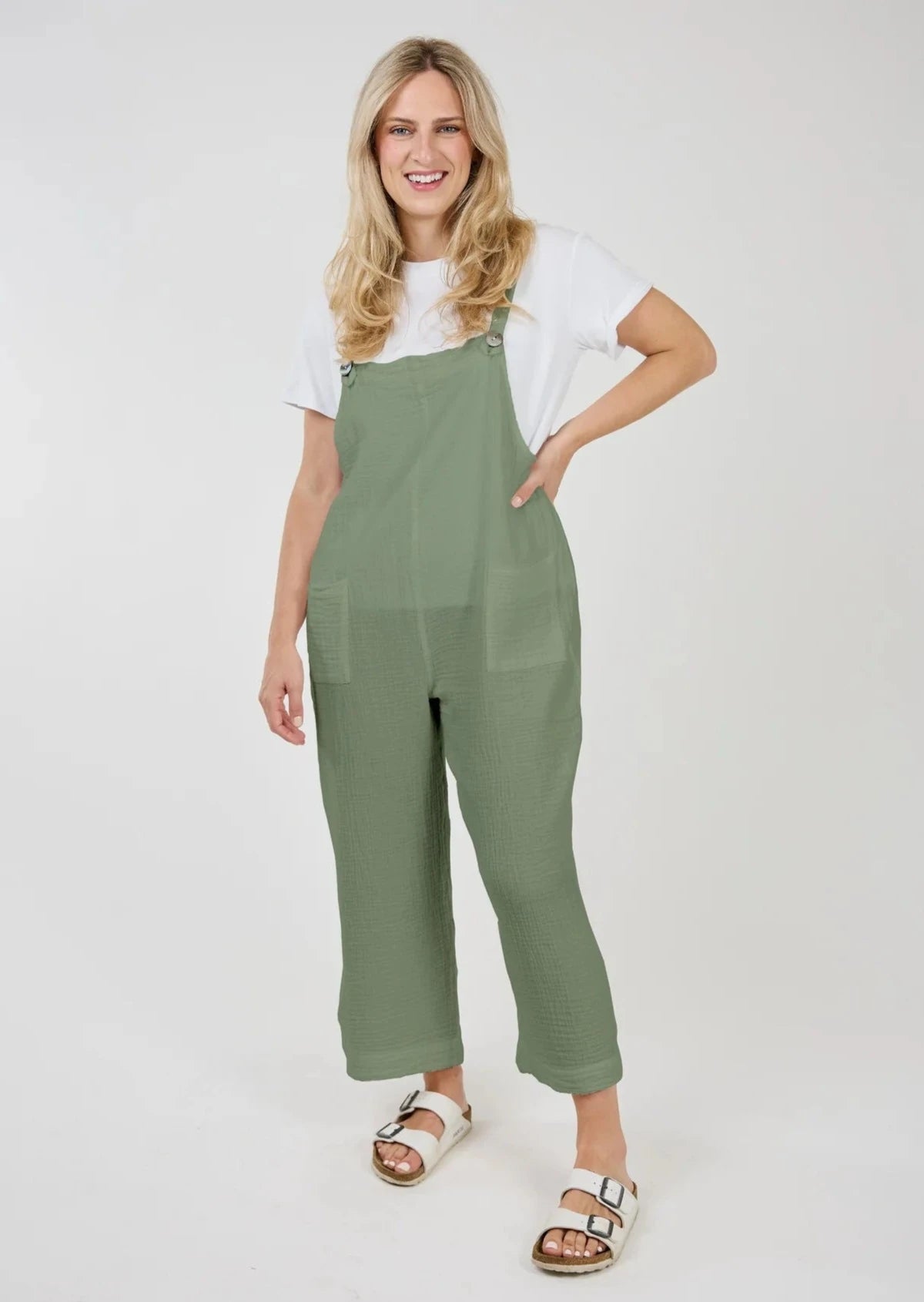 Front view of model wearing Grace Cotton Gauze Overalls with a white tee shirt.