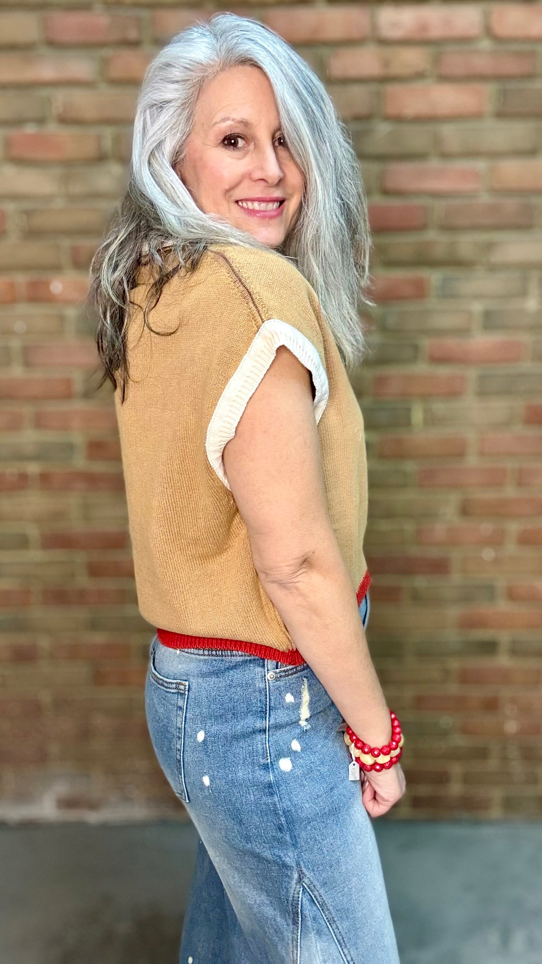 Woman wearing Chestnut Flame Sweater paired with Bleached Wide Leg Jeans and Heads Up - Red Shoes styled with XOXO heart on Red Bead Necklace