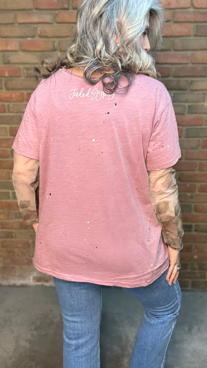 Woman wearing Moon Dance Tee - Cherished Heart tee against brick wall.