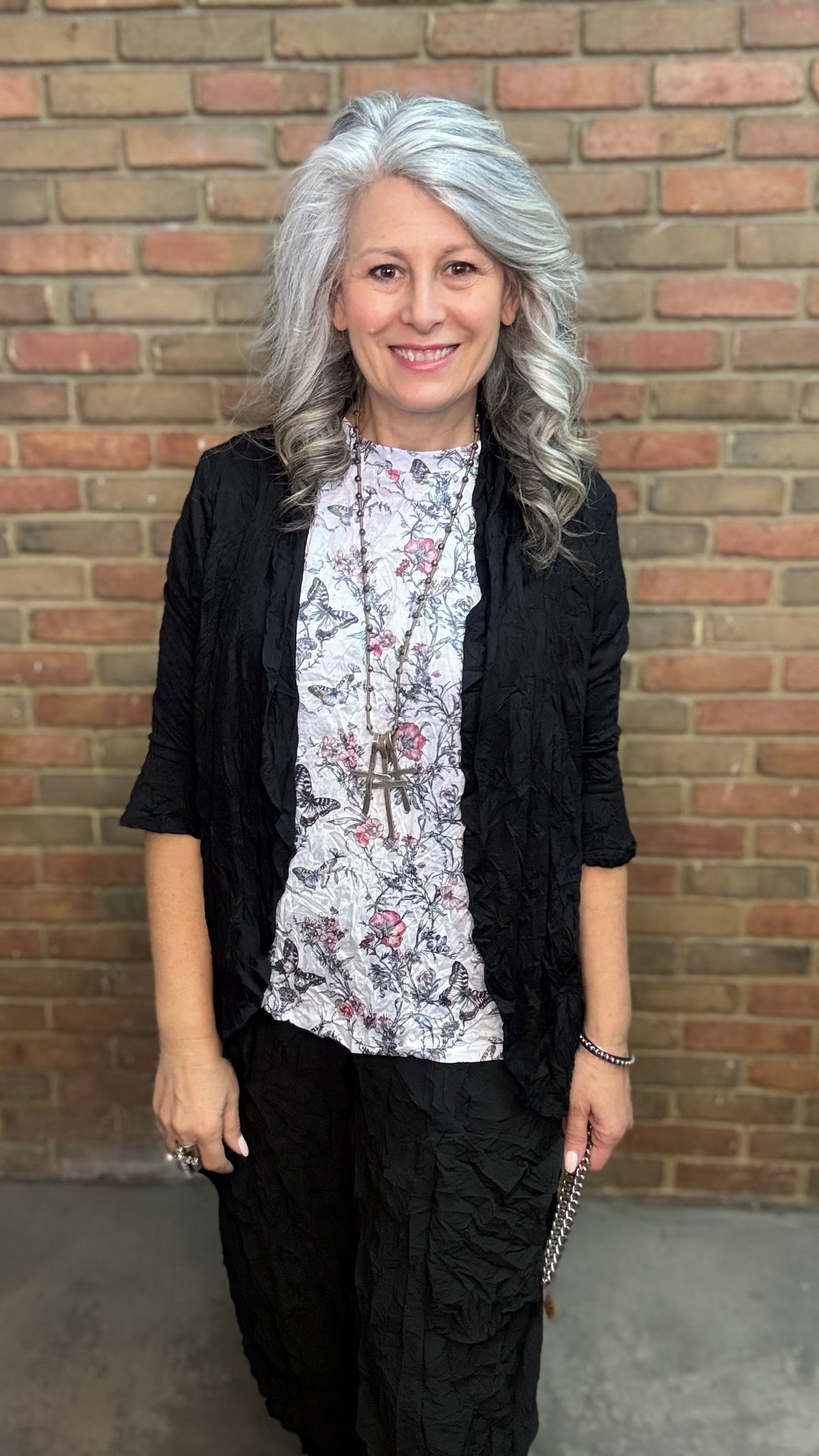 Person wearing Black Crinkle Side Pocket Pant and Black Solid Crinkle Tie Cardigan.
