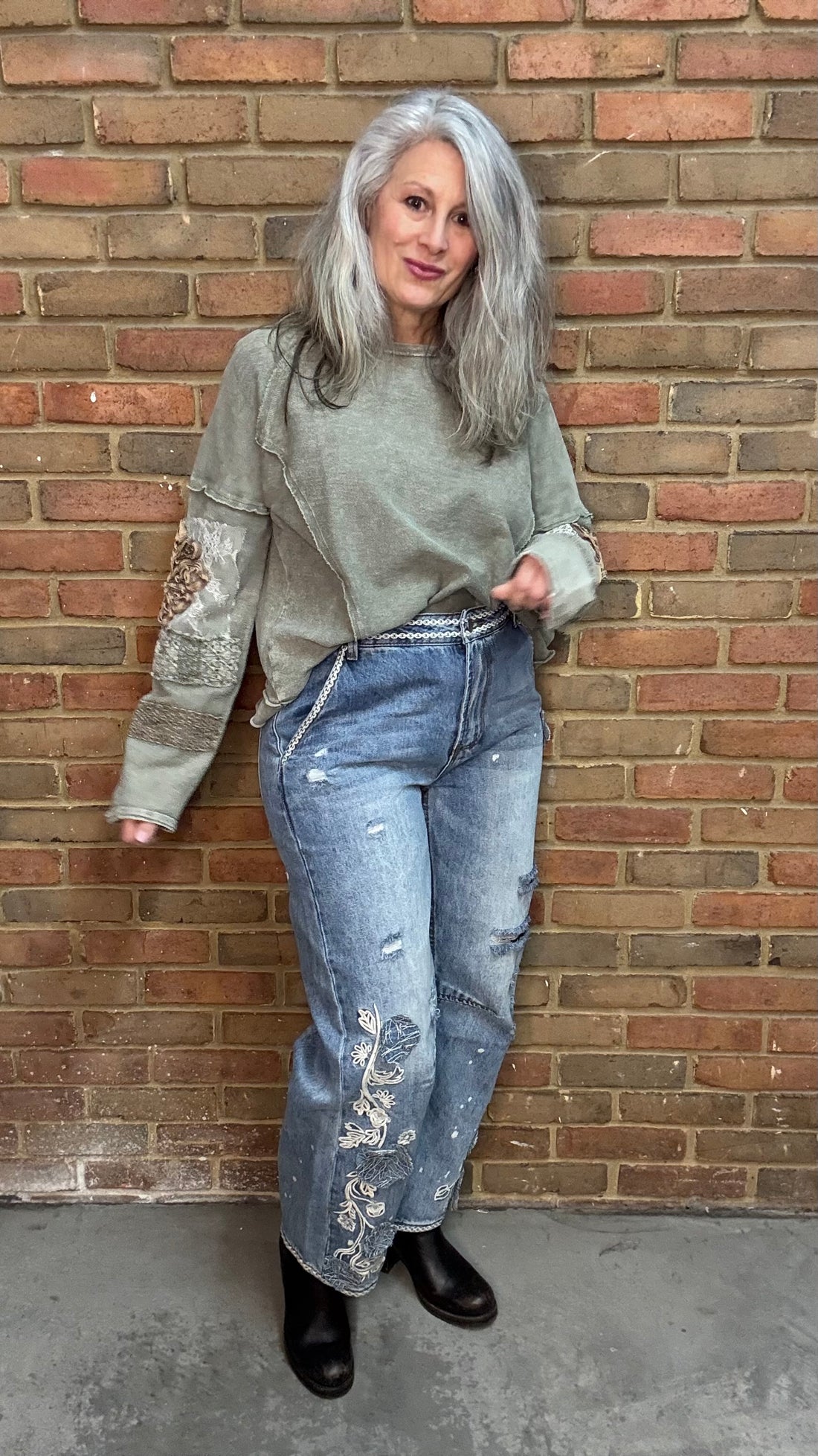 Woman wearing Olive Embellished Sleeve Top and Floral Embroidered Relaxed Jean 1083
