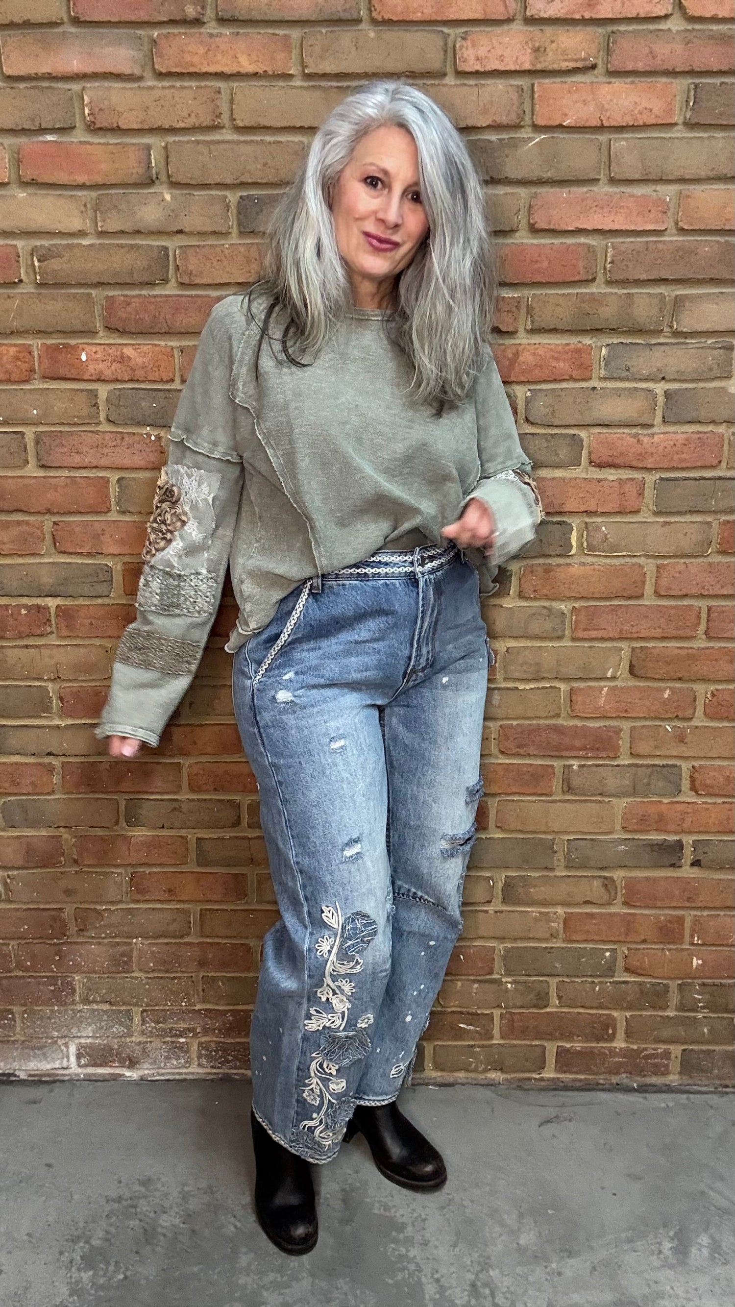 Woman wearing Olive Embellished Sleeve Top and Floral Embroidered Relaxed Jean 1083
