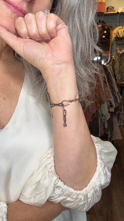 Person wearing a bracelet with a blurred background