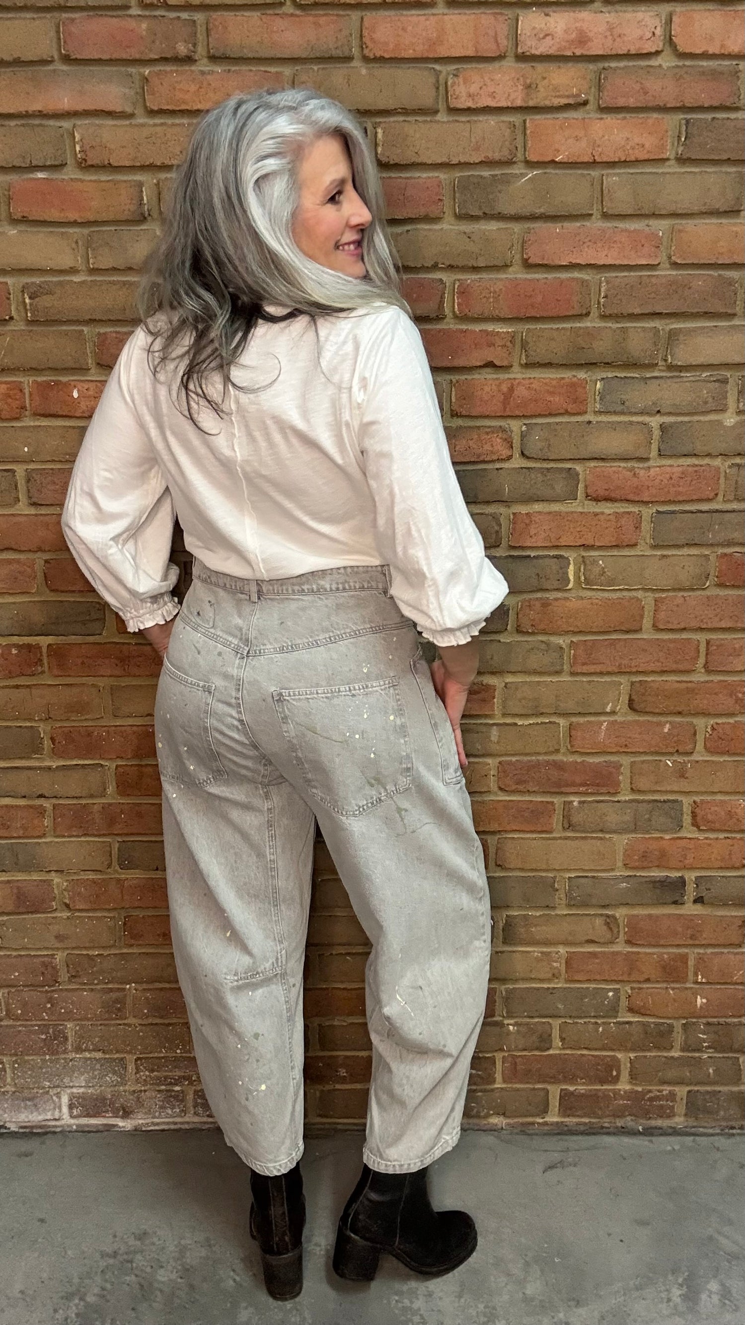 Person wearing Oyster Grey Big Pocket Jeans paired with Basic Long Sleeve Crew Neck Top