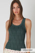 Woman wearing a green knitted tank top against a plain background
