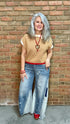 Woman wearing Chestnut Flame Sweater paired with Bleached Wide Leg Jeans and Heads Up - Red Shoes styled with XOXO heart on Red Bead Necklace