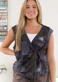 front view of Patchwork Charcoal Vest on a model wearing it over a tank top.
