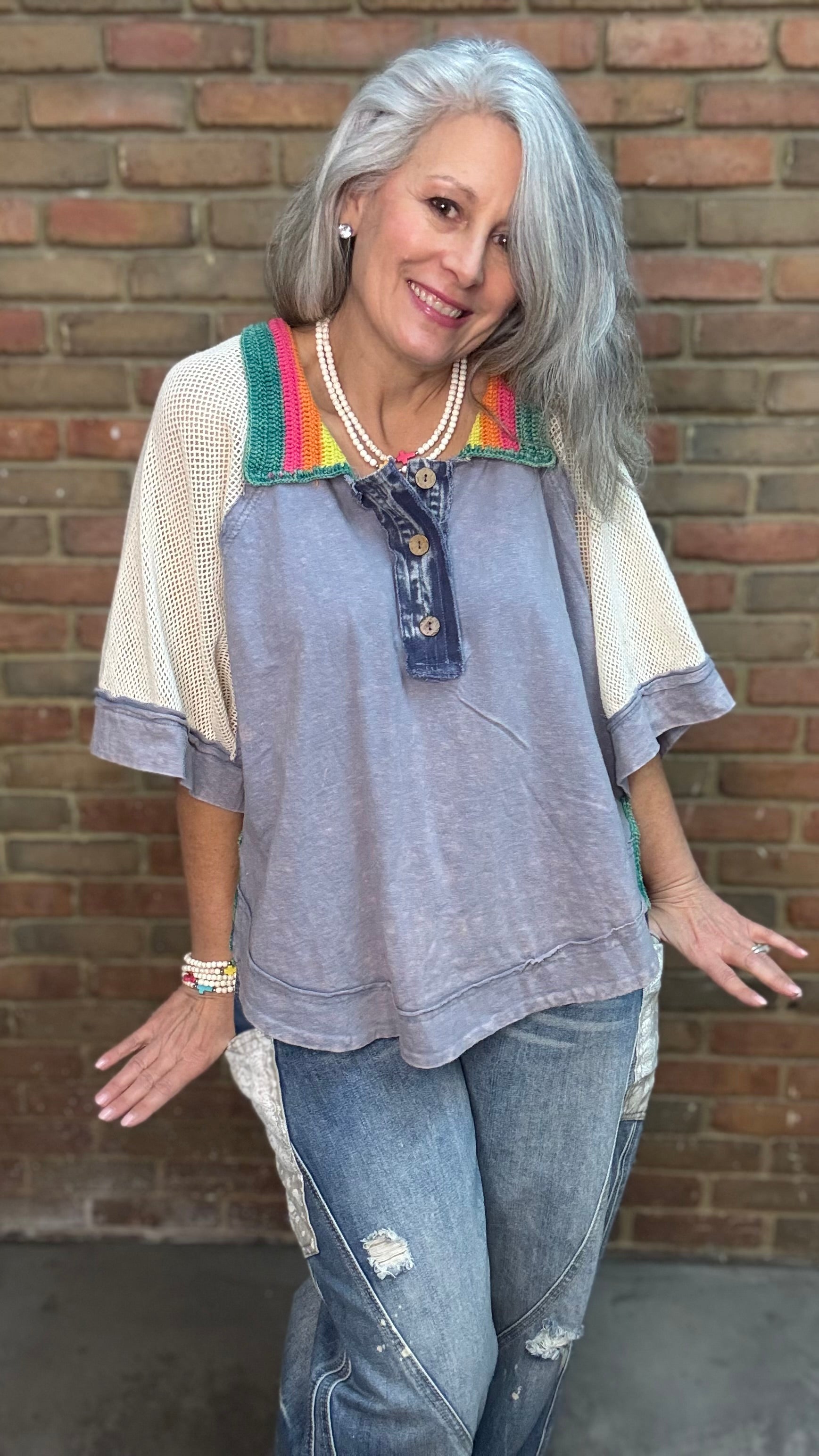 Woman wearing Rainbow Collar Henley Top paired with Big Pocket Denim Pants and the Brittney Necklace and Brittney 5 Piece Bracelet Set