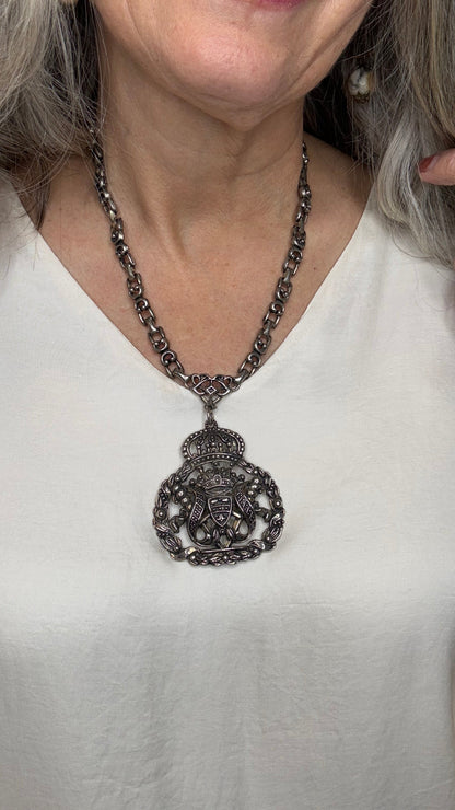 Close-up of a decorative chain accessory on a person&