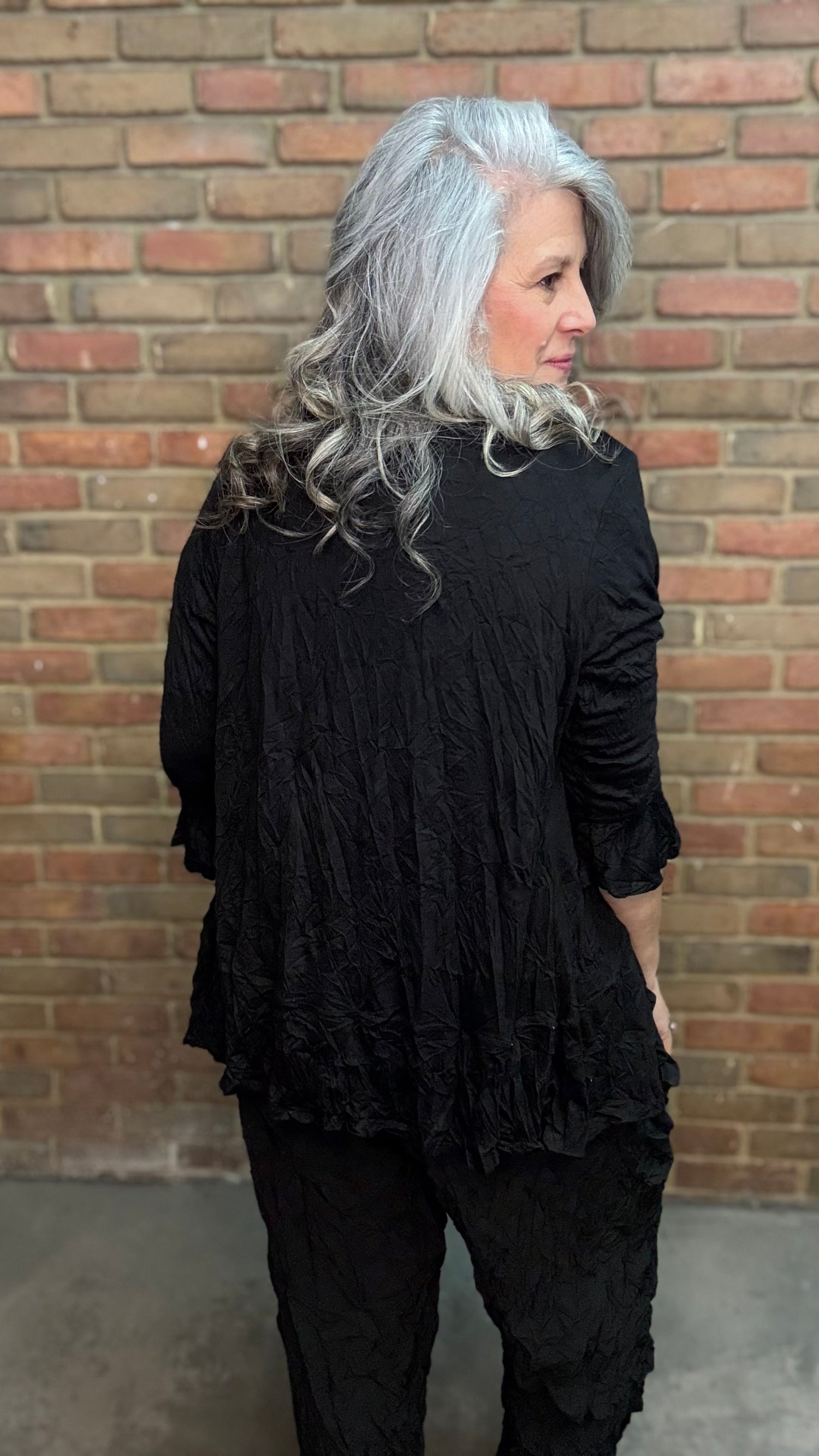 Person wearing Black Crinkle Side Pocket Pant and Black Solid Crinkle Tie Cardigan.