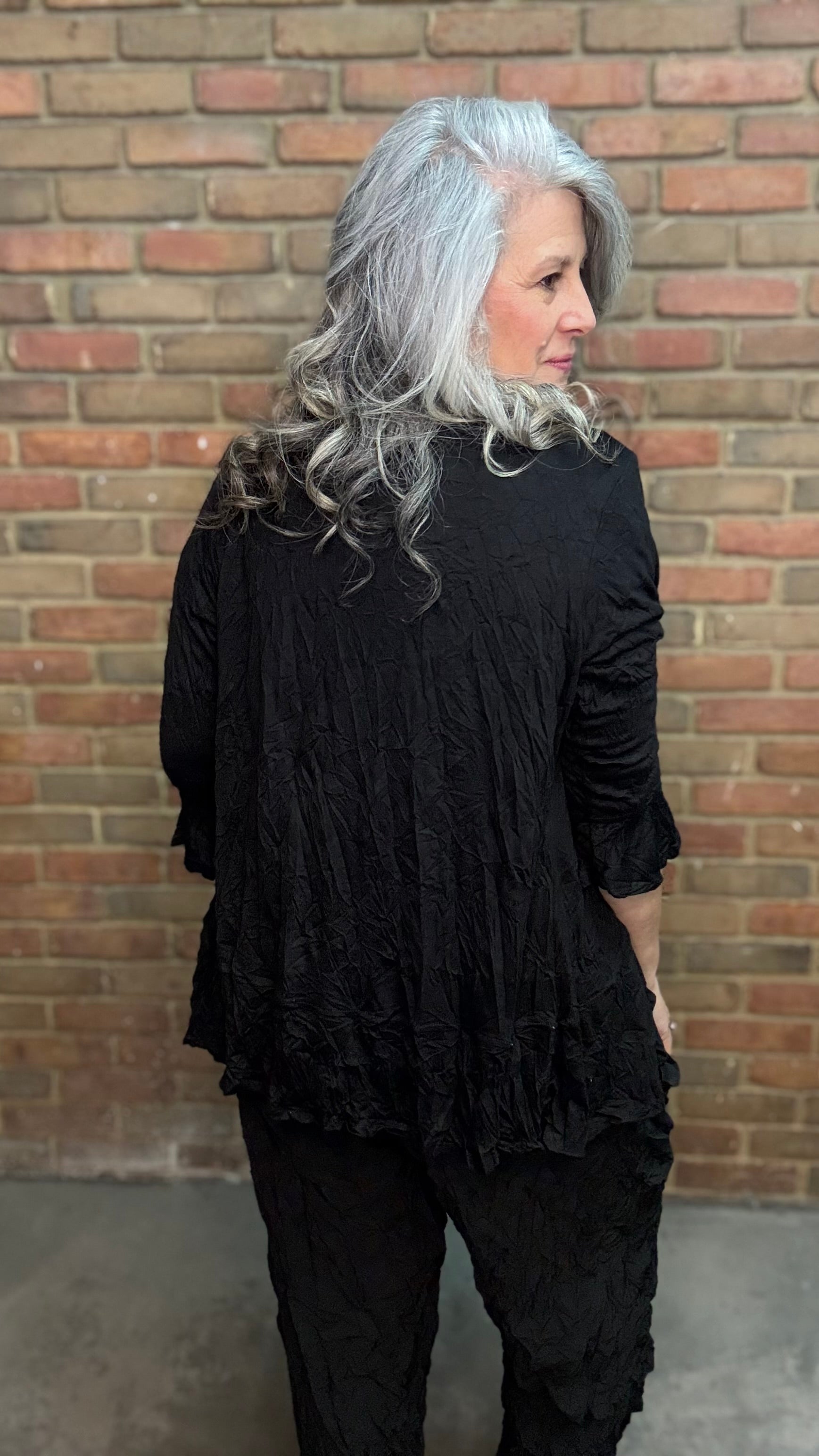 Person wearing Black Crinkle Side Pocket Pant and Black Solid Crinkle Tie Cardigan.